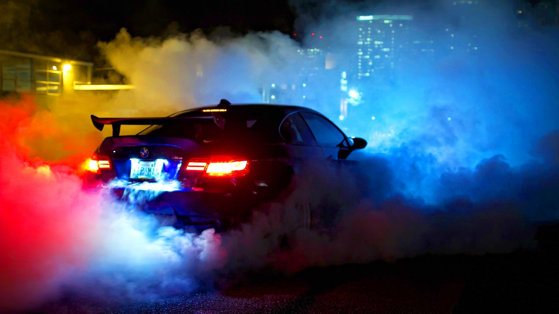 BMW car doing a burnout at night HD Wallpaper
