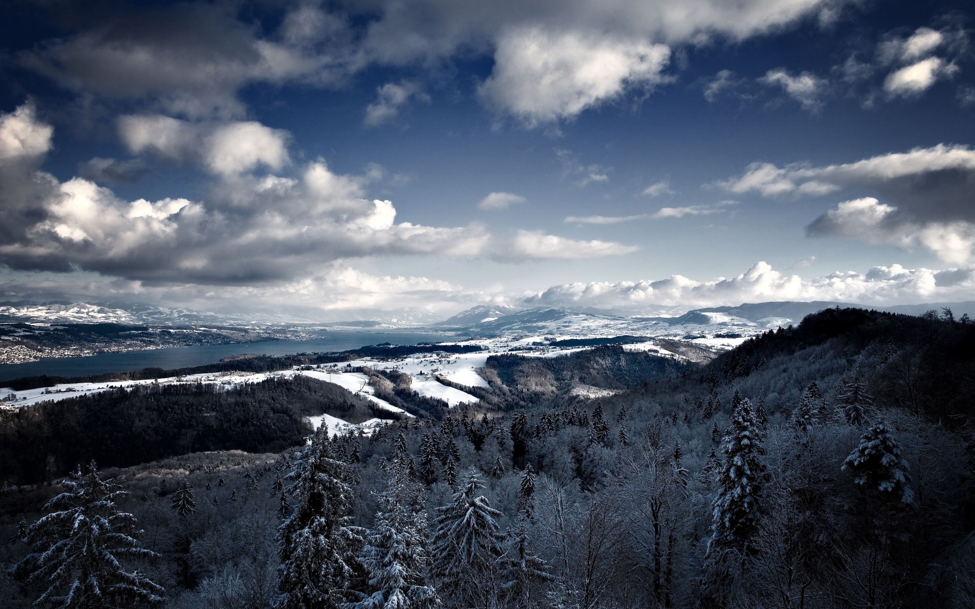 Snowy mountains and lake under cloudy sky HD Wallpaper