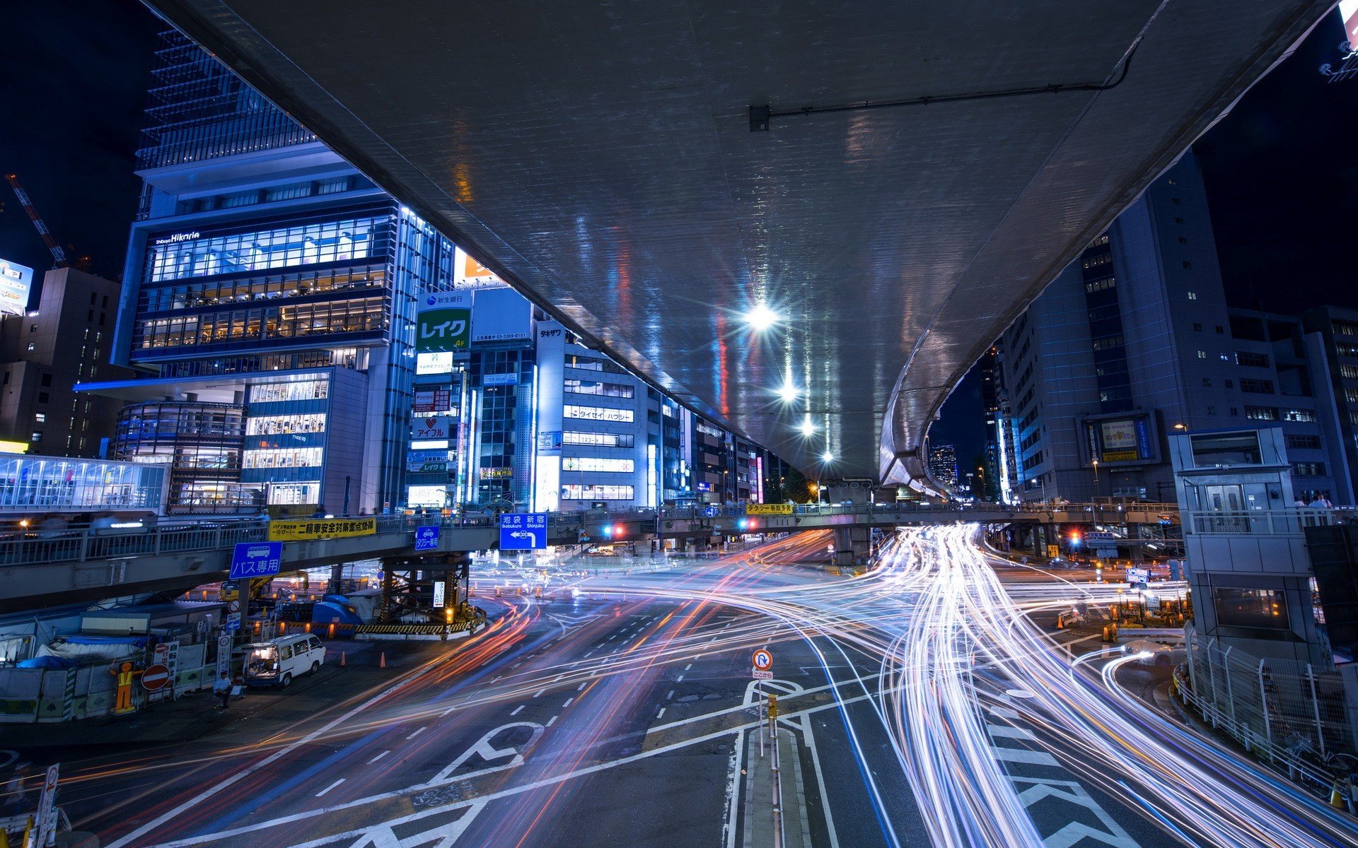 Tokyo street at night with light trails from cars HD Wallpaper