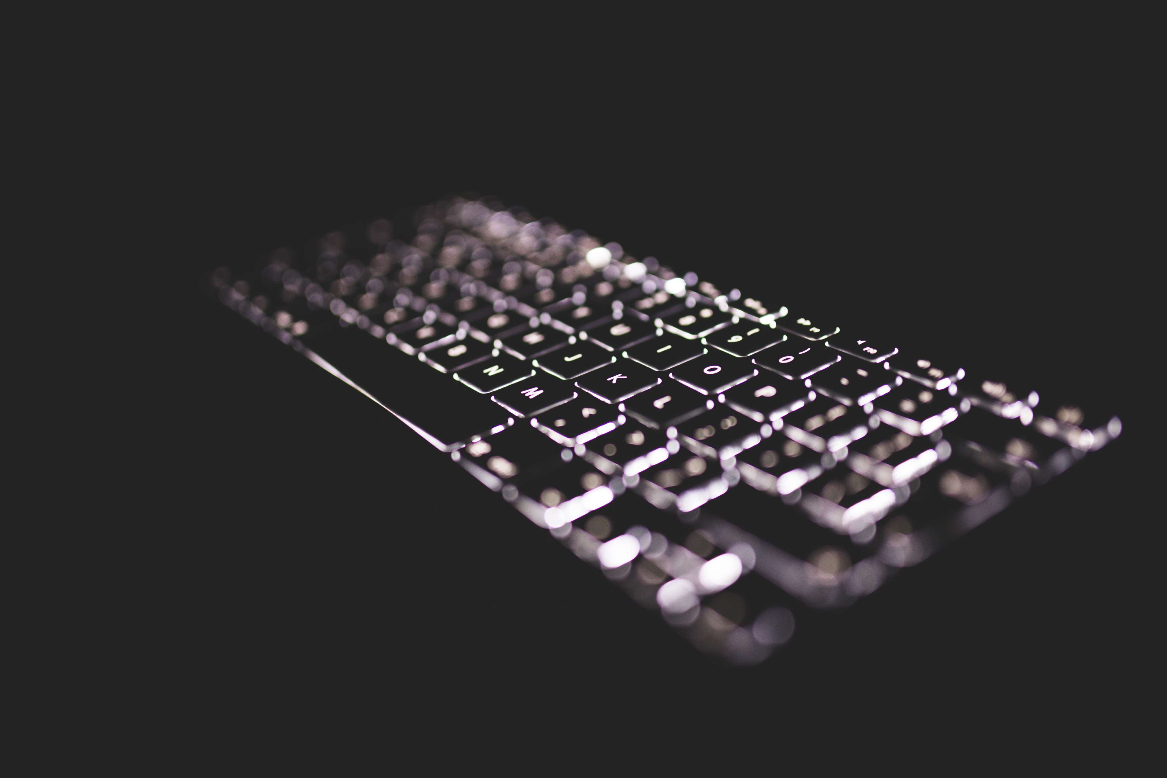 Backlit computer keyboard in the dark 4K HD Wallpaper
