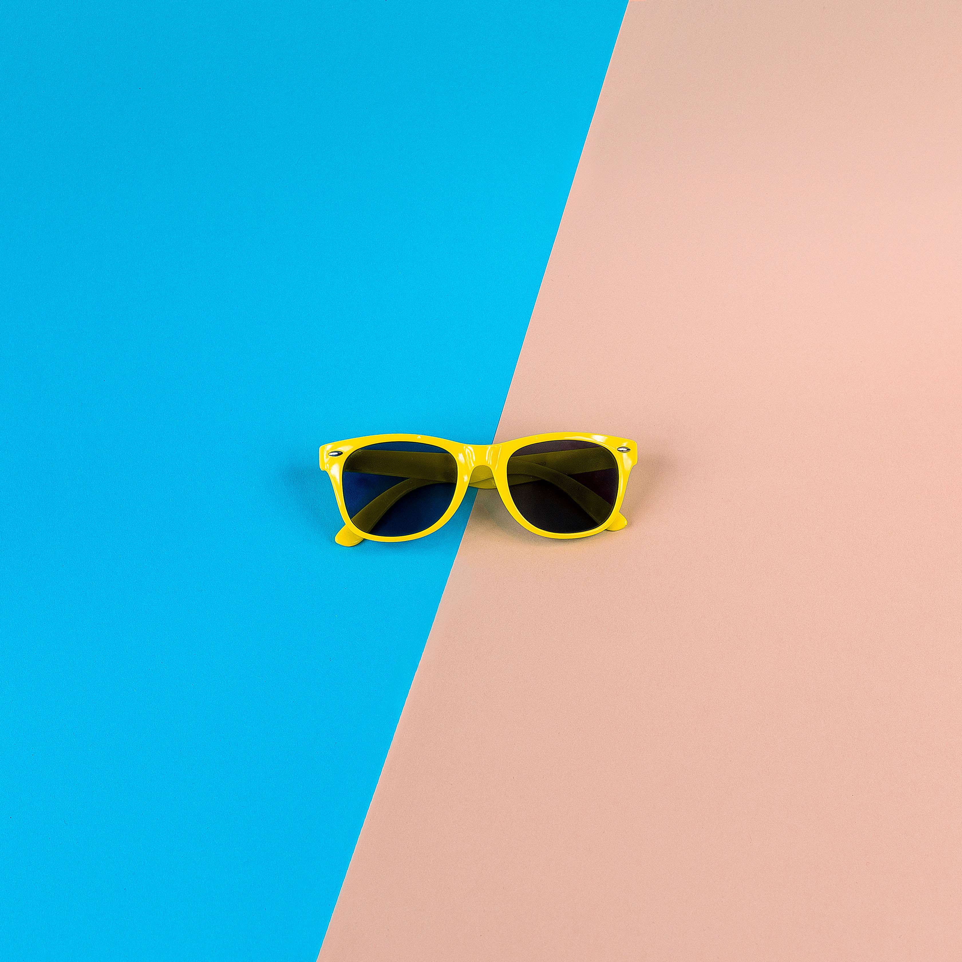 Yellow Wayfarer Sunglasses on Pastel Background HD Wallpaper