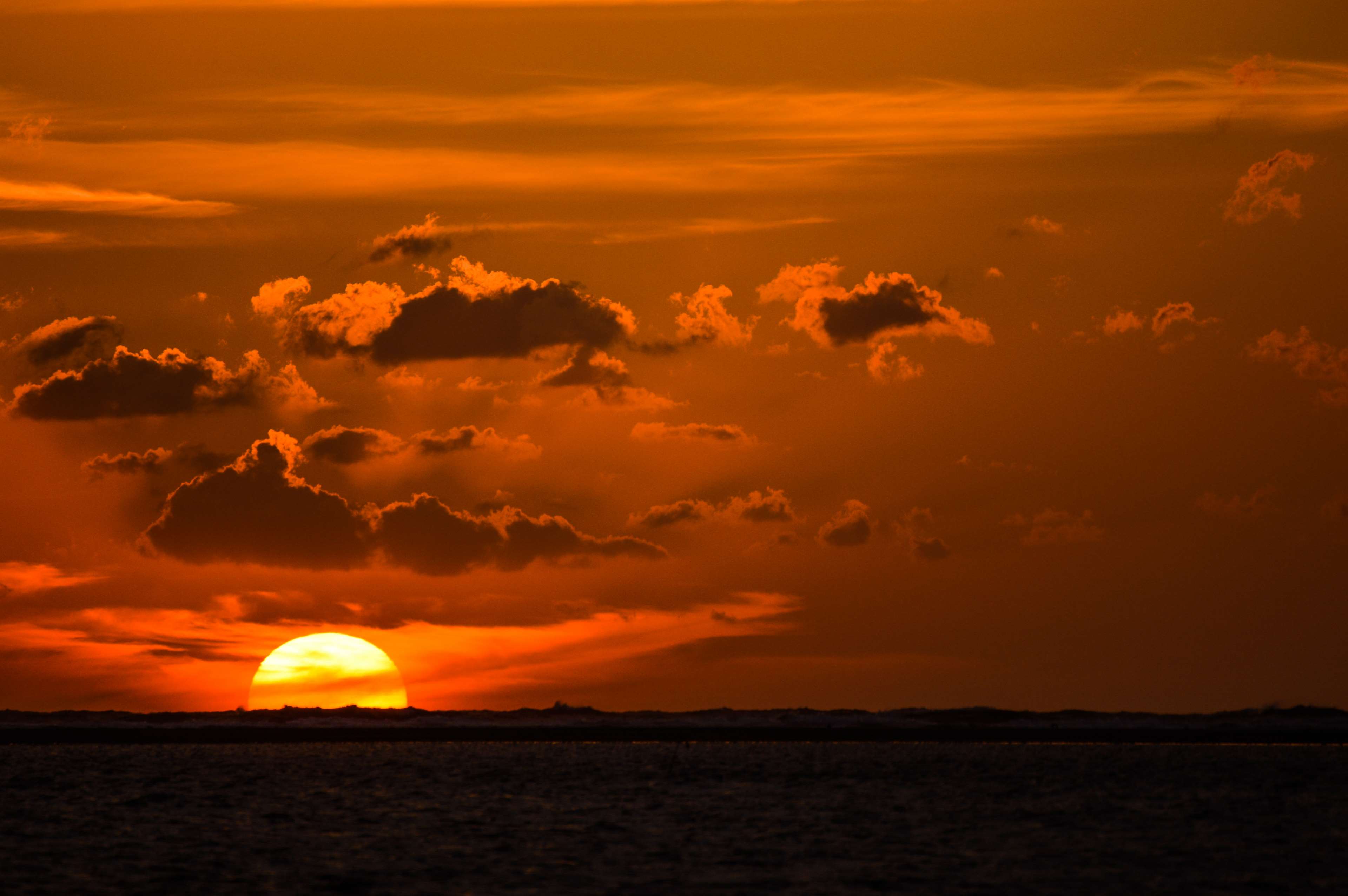 Sunset over the sea with clouds HD Wallpaper