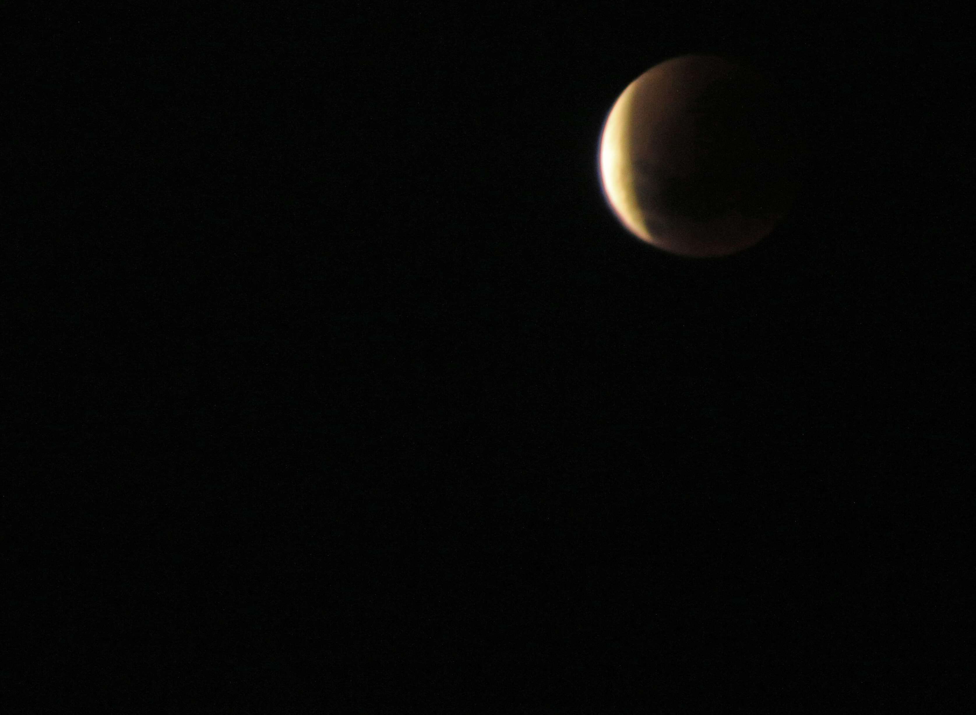 Partial Lunar Eclipse in the Night Sky HD Wallpaper