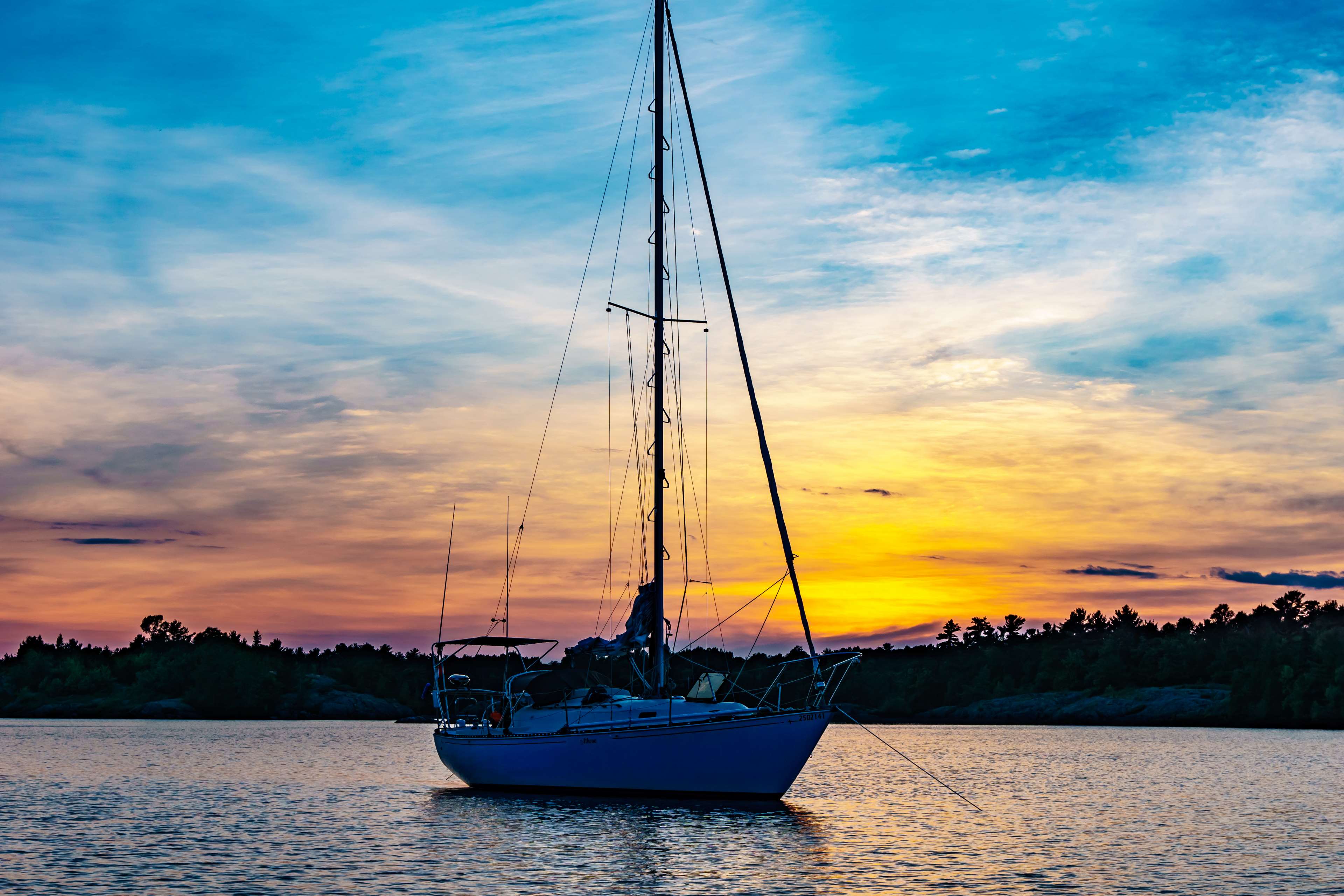 Sailboat on the water at sunset 4K HD Wallpaper