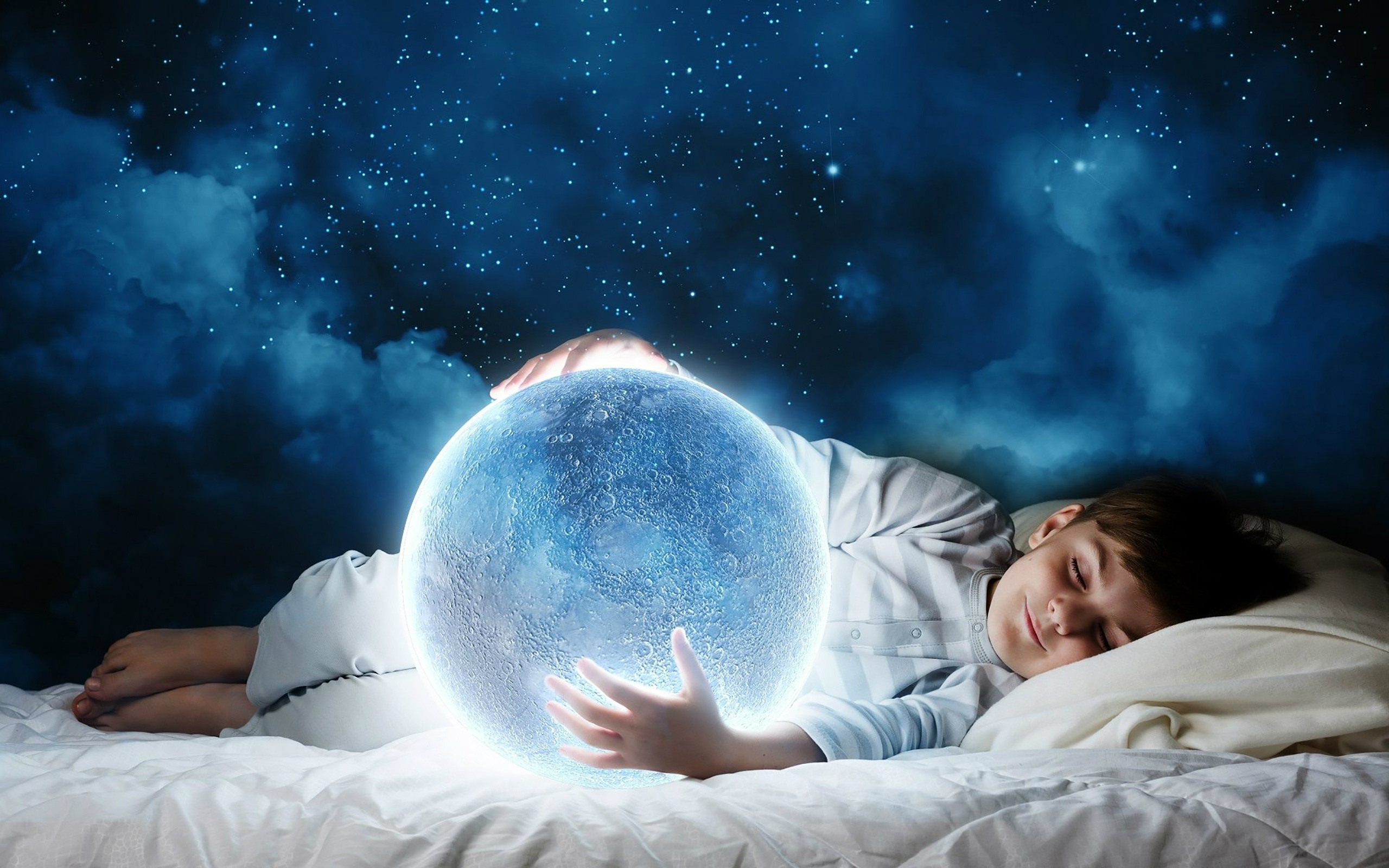Child sleeping and holding a glowing moon HD Wallpaper