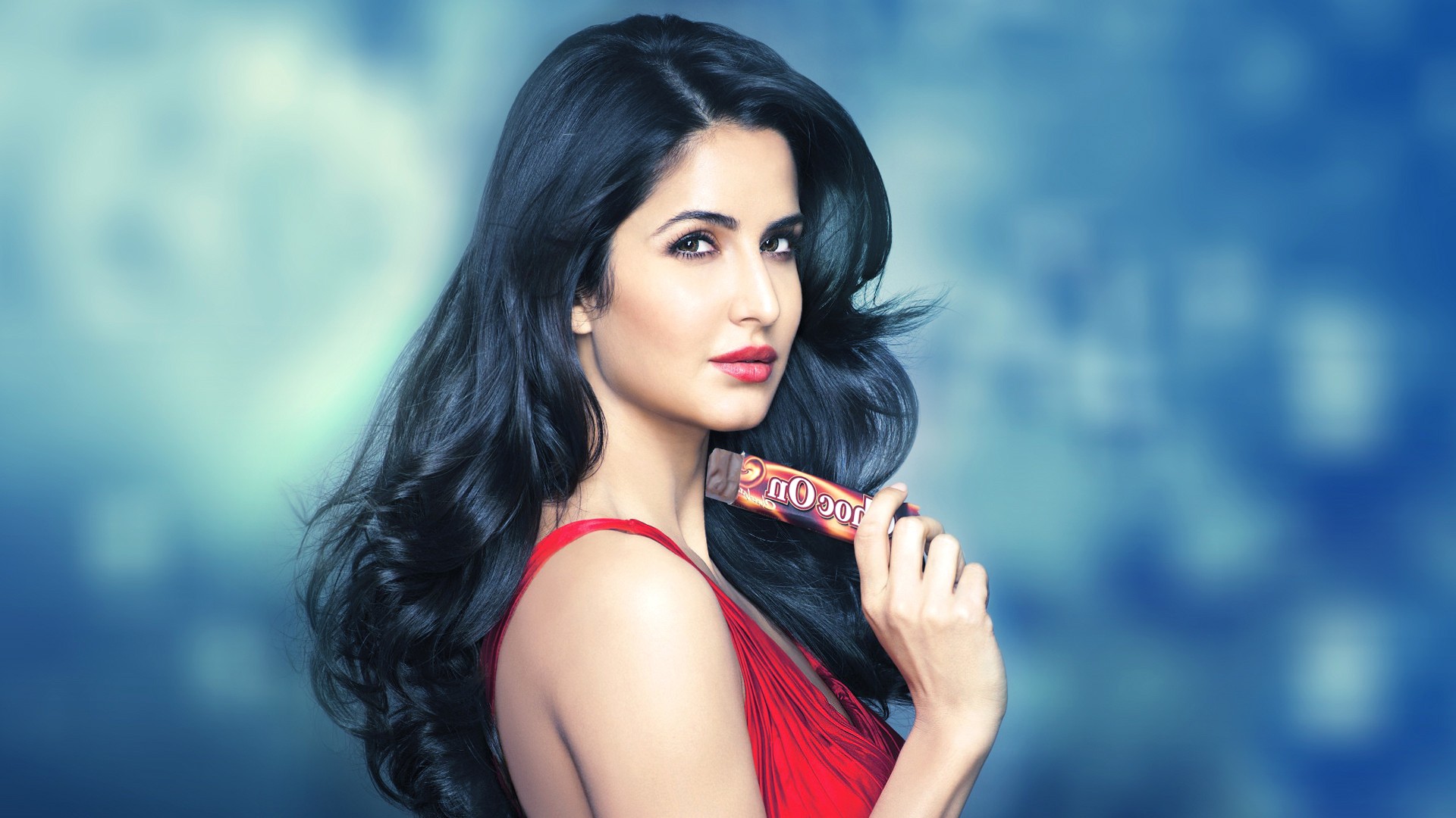 Katrina Kaif holding a chocolate bar HD Wallpaper