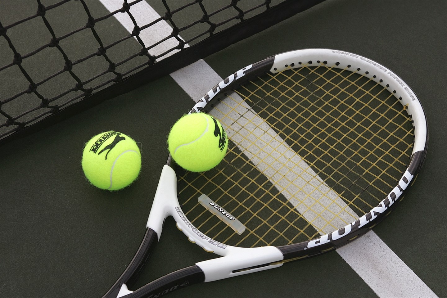 Tennis racket and balls on court HD Wallpaper