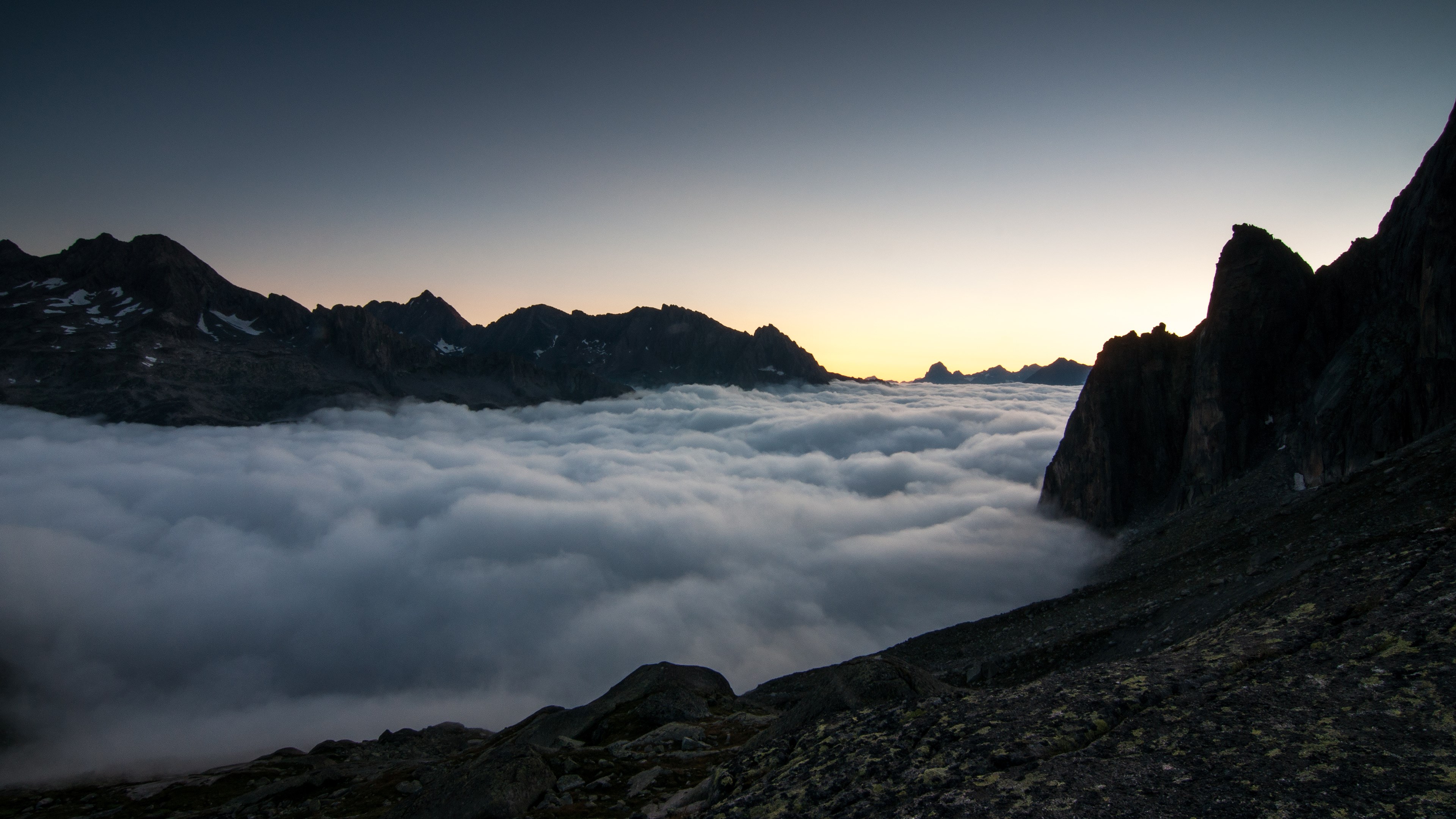 Mountains above clouds at dawn 4K HD Wallpaper