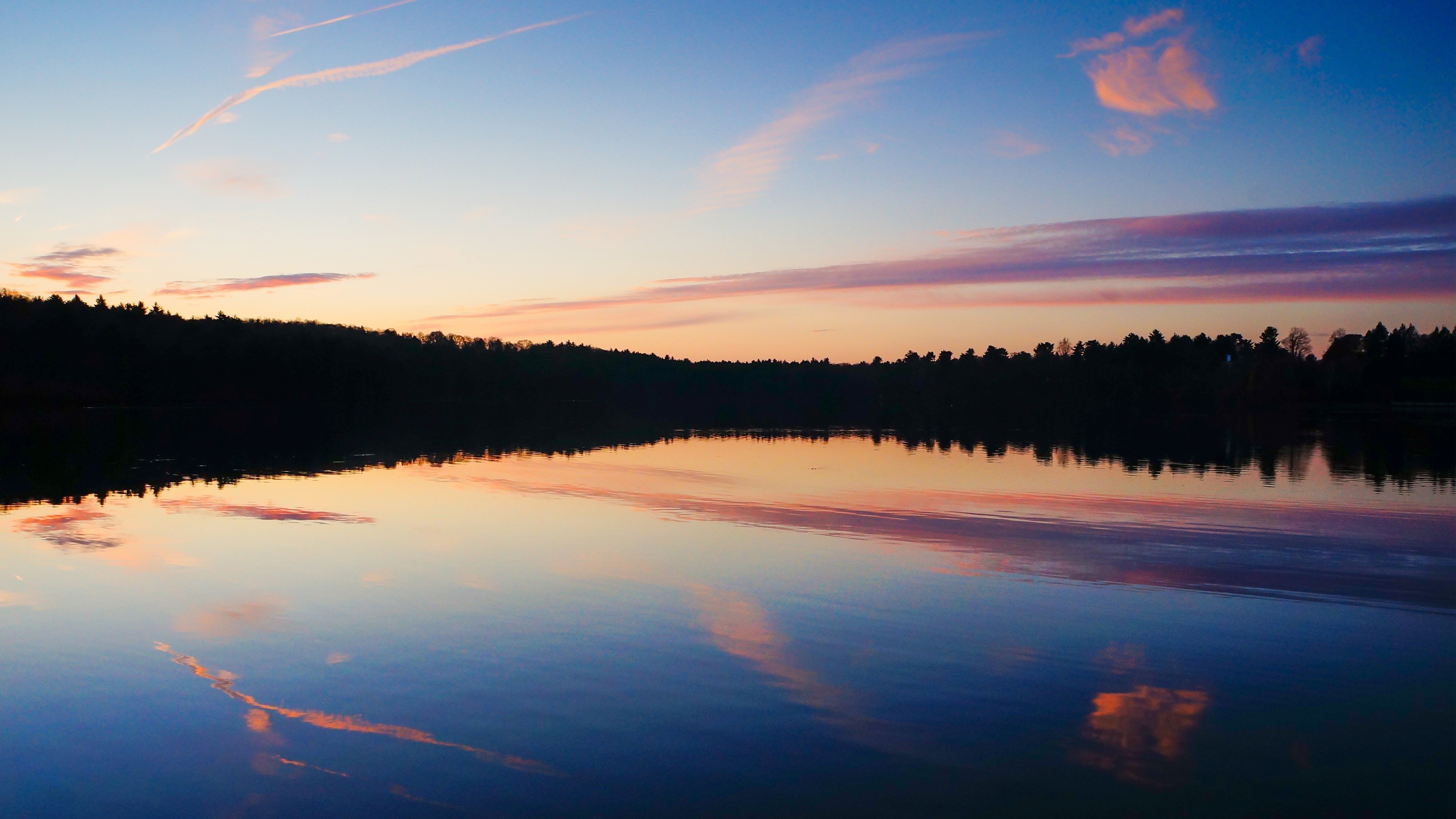 Sunset over a lake with forest reflection HD Wallpaper