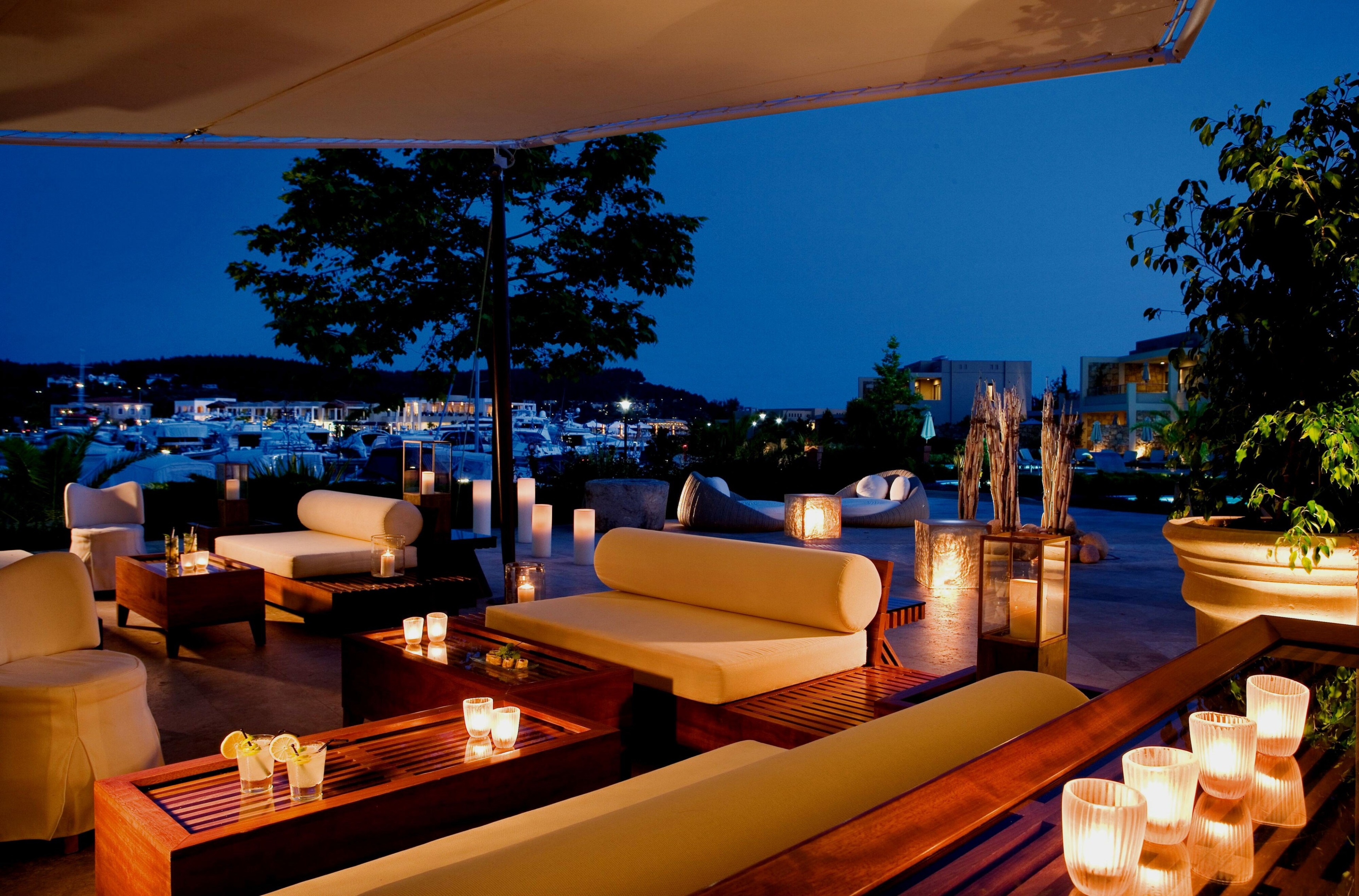 Outdoor lounge area at Sani Beach Hotel spa 4K HD Wallpaper