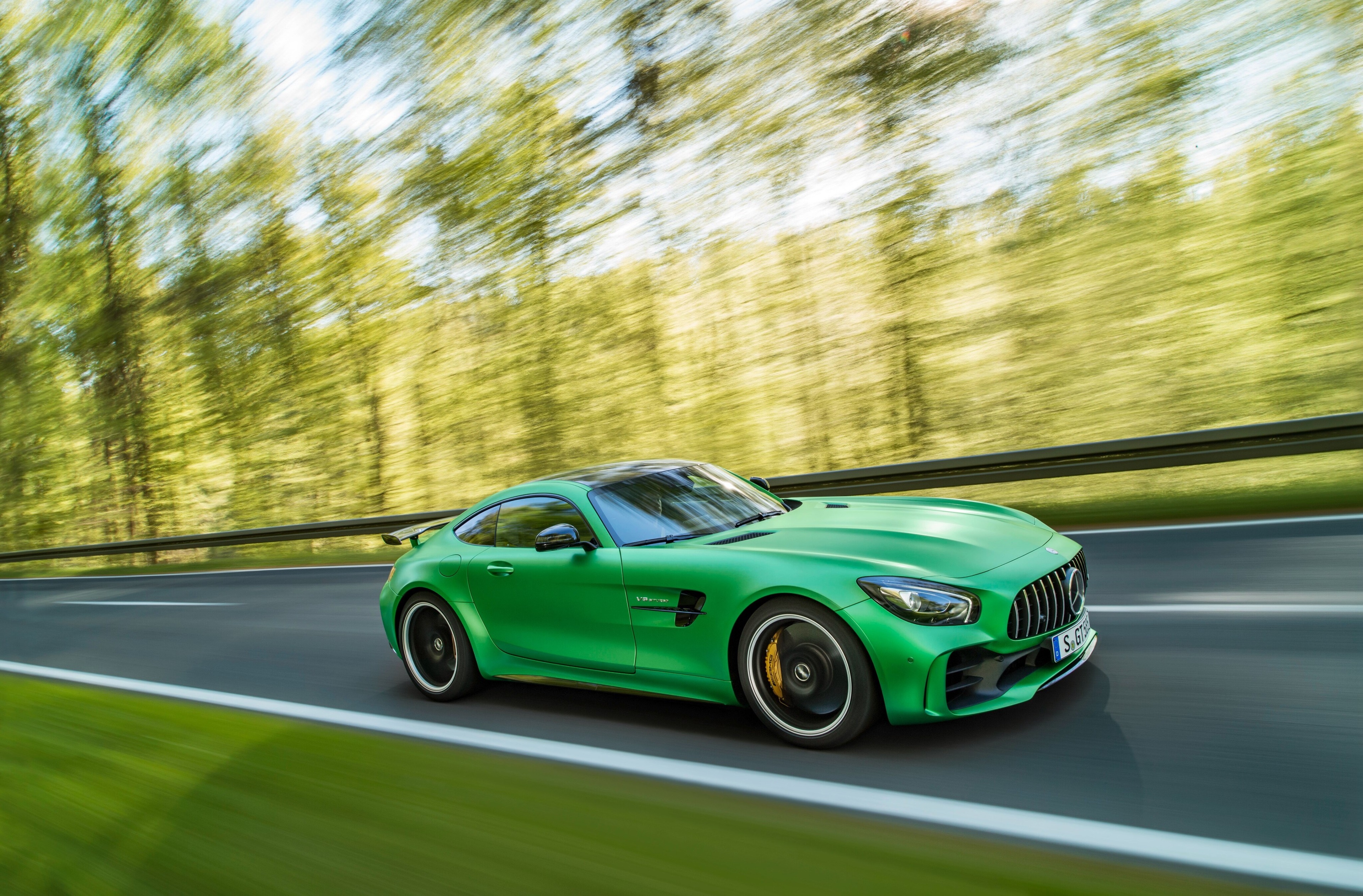 Green Mercedes-AMG GT R driving on a road HD Wallpaper