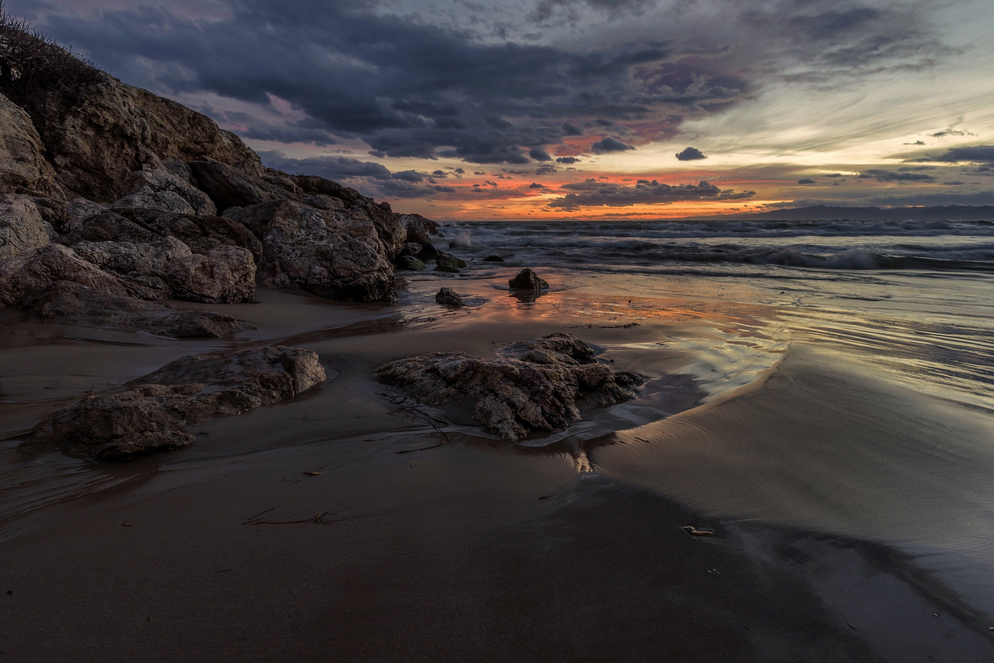Beach rocks and ocean at sunset 4K HD Wallpaper