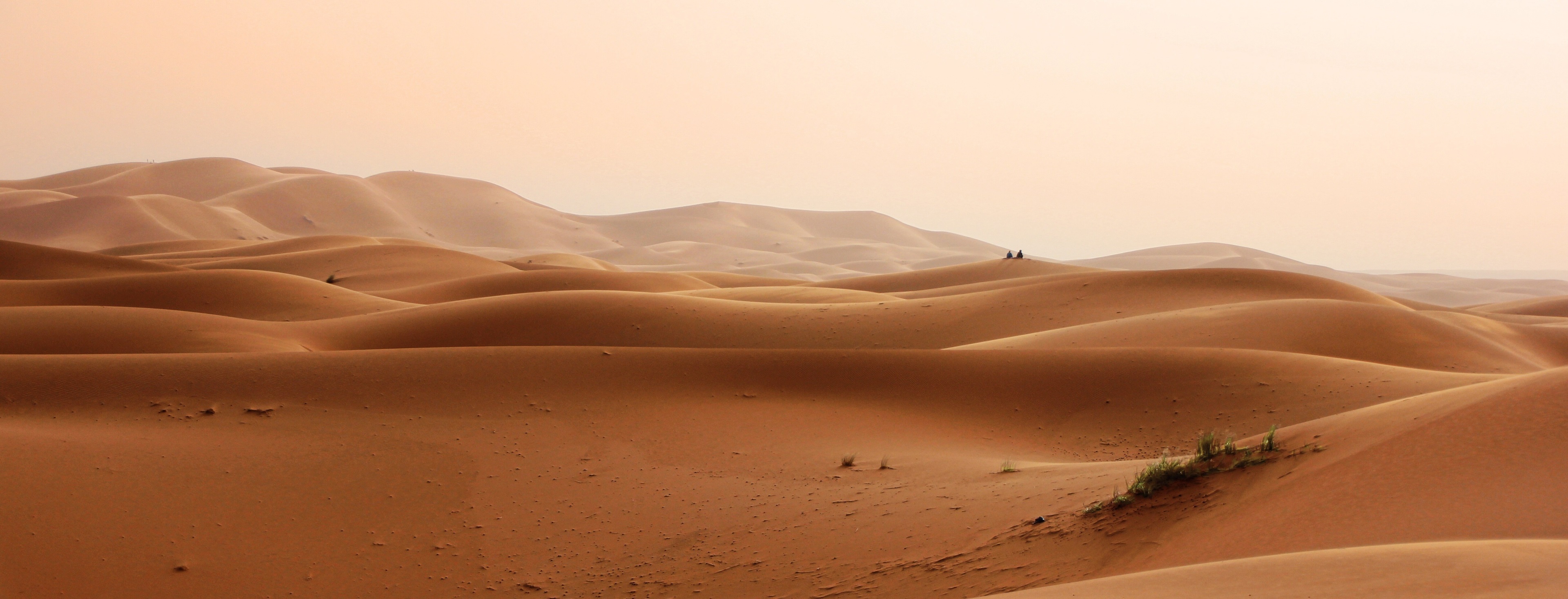 Expansive Desert Landscape with Rolling Sand Dunes 4K HD Wallpaper