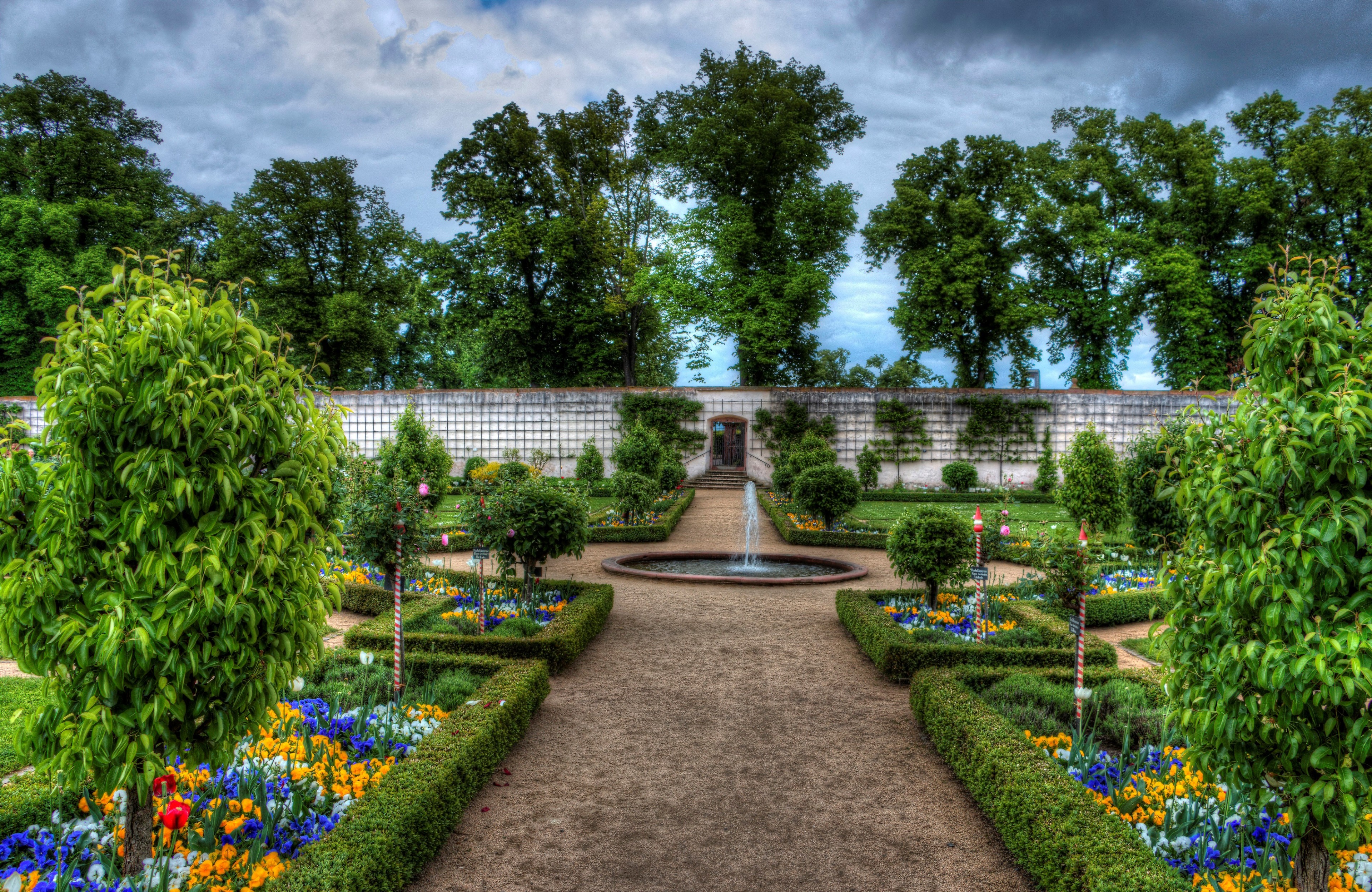 Formal garden with fountain and flowers HD Wallpaper