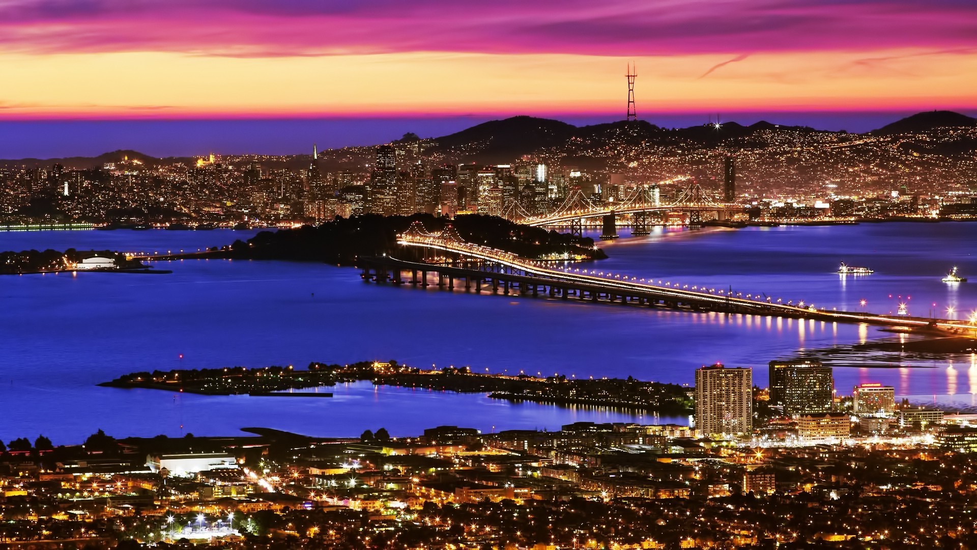 San Francisco Bay Bridge and skyline at sunset HD Wallpaper