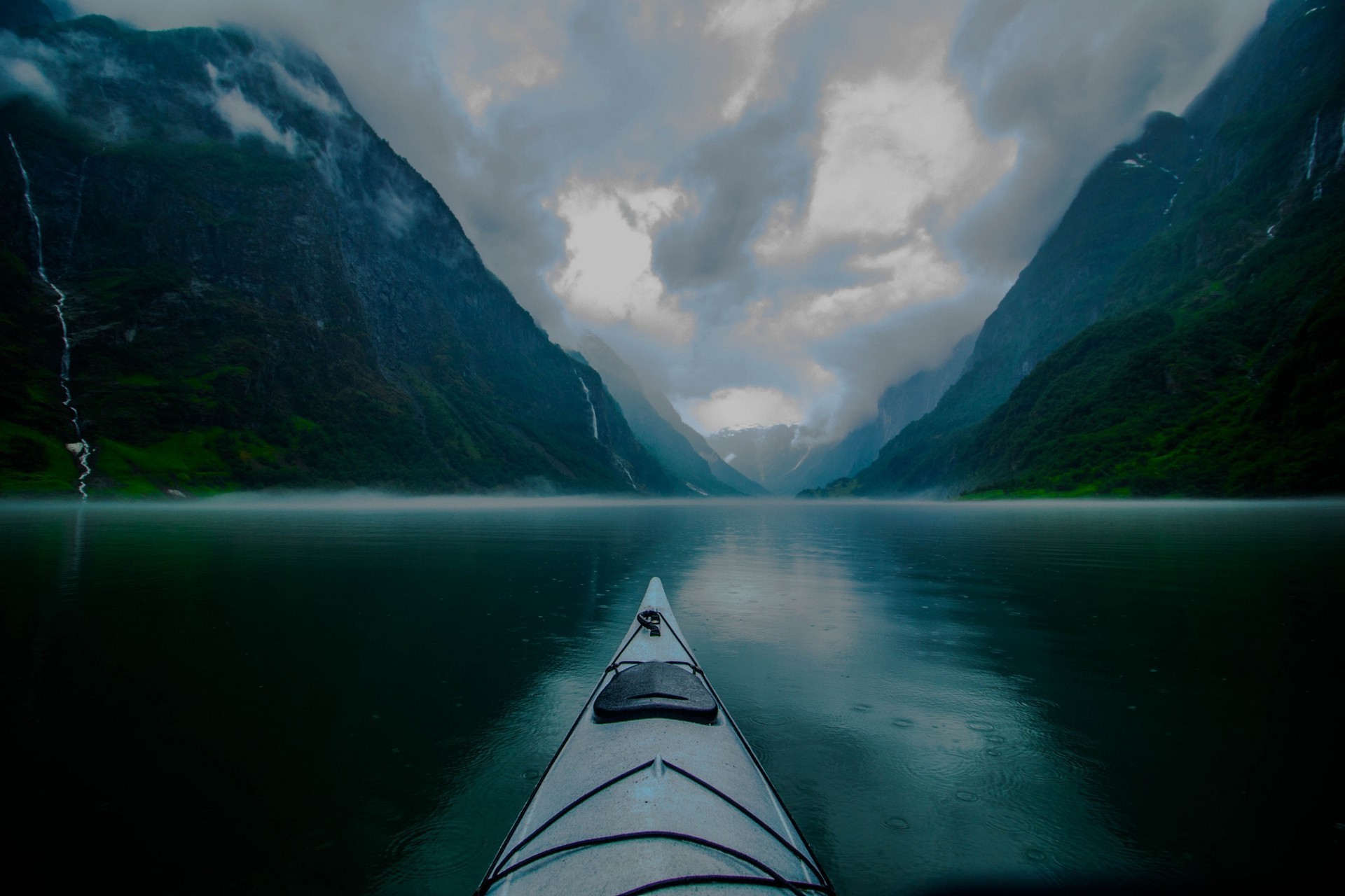 Kayaking through a misty fjord in Norway HD Wallpaper