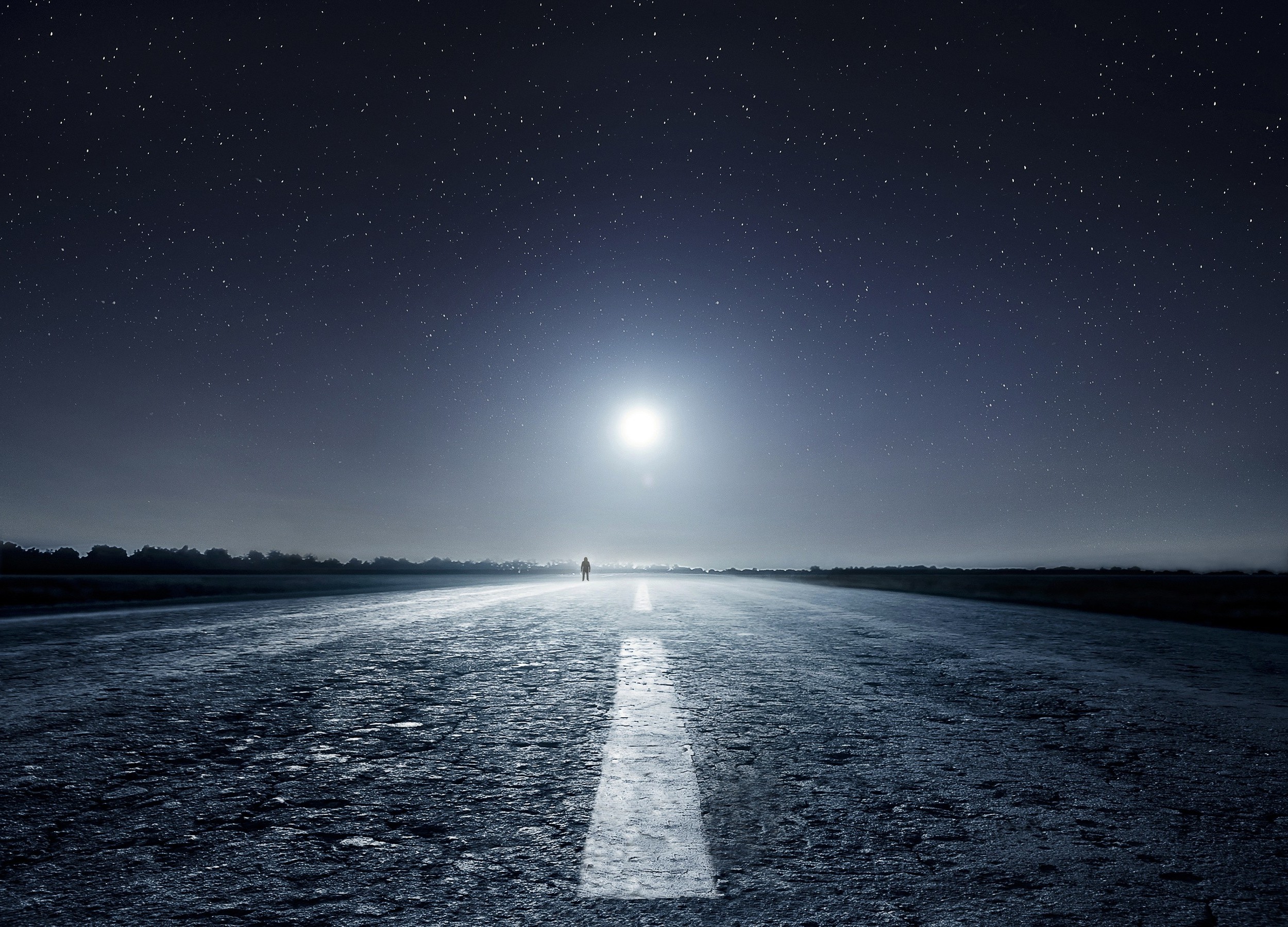 Man standing on a road under a starry night sky with moon HD Wallpaper