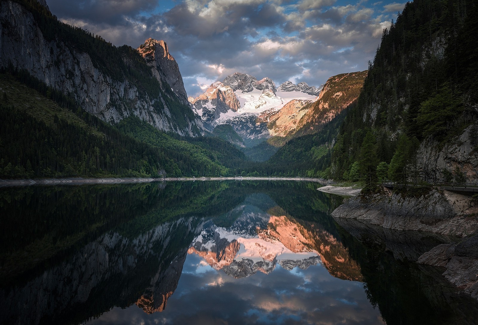 Mountain lake reflection with snow-capped peaks and clouds HD Wallpaper