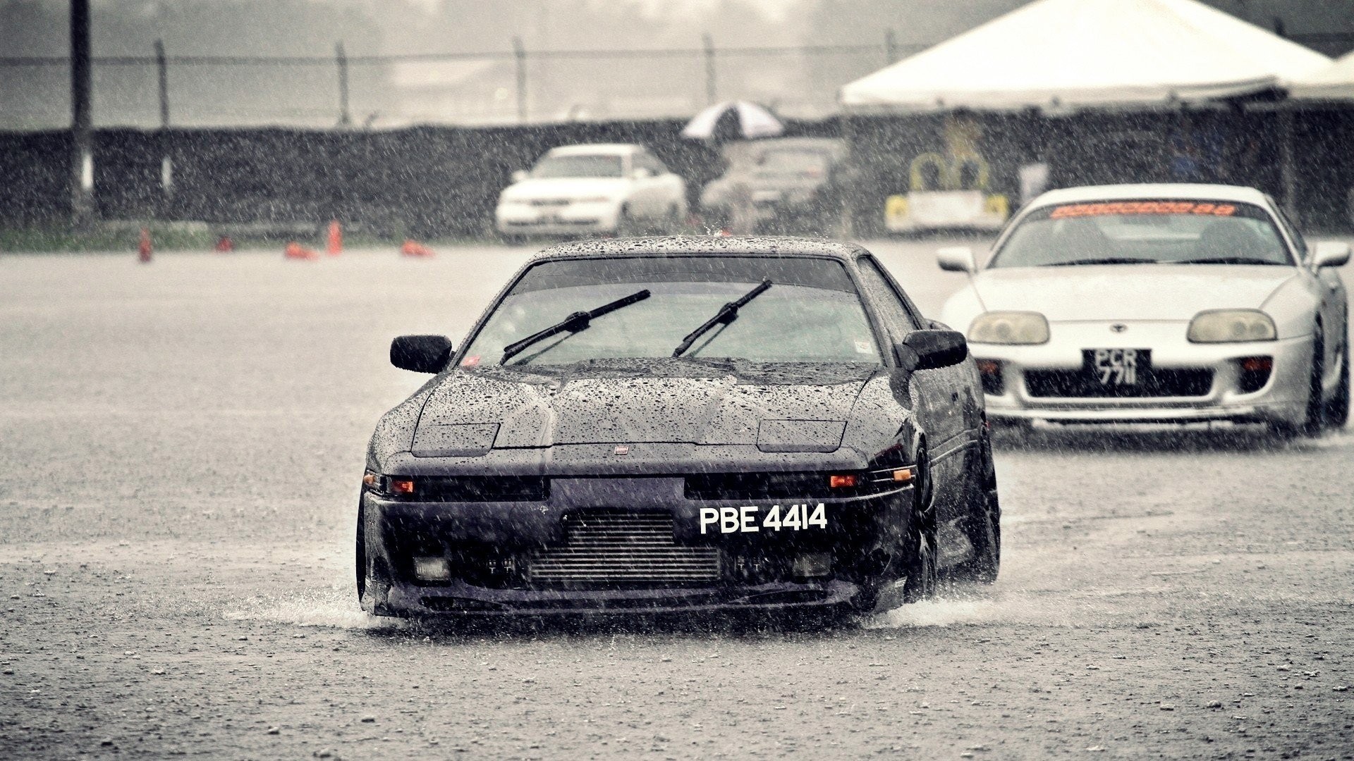 Toyota Supra MK3 and MK4 Driving in Rain HD Wallpaper