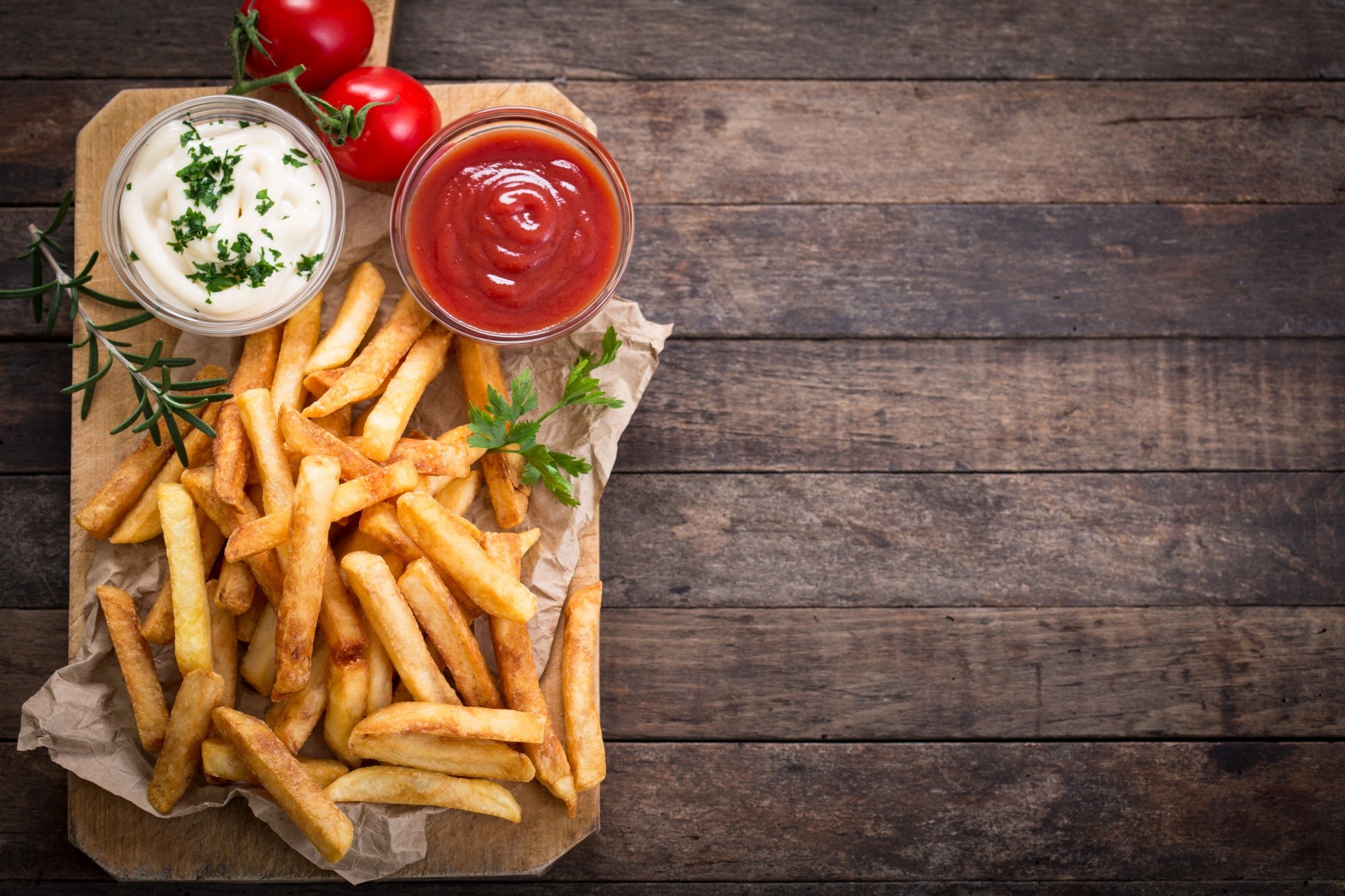 French fries with ketchup and mayonnaise on a wooden board HD Wallpaper