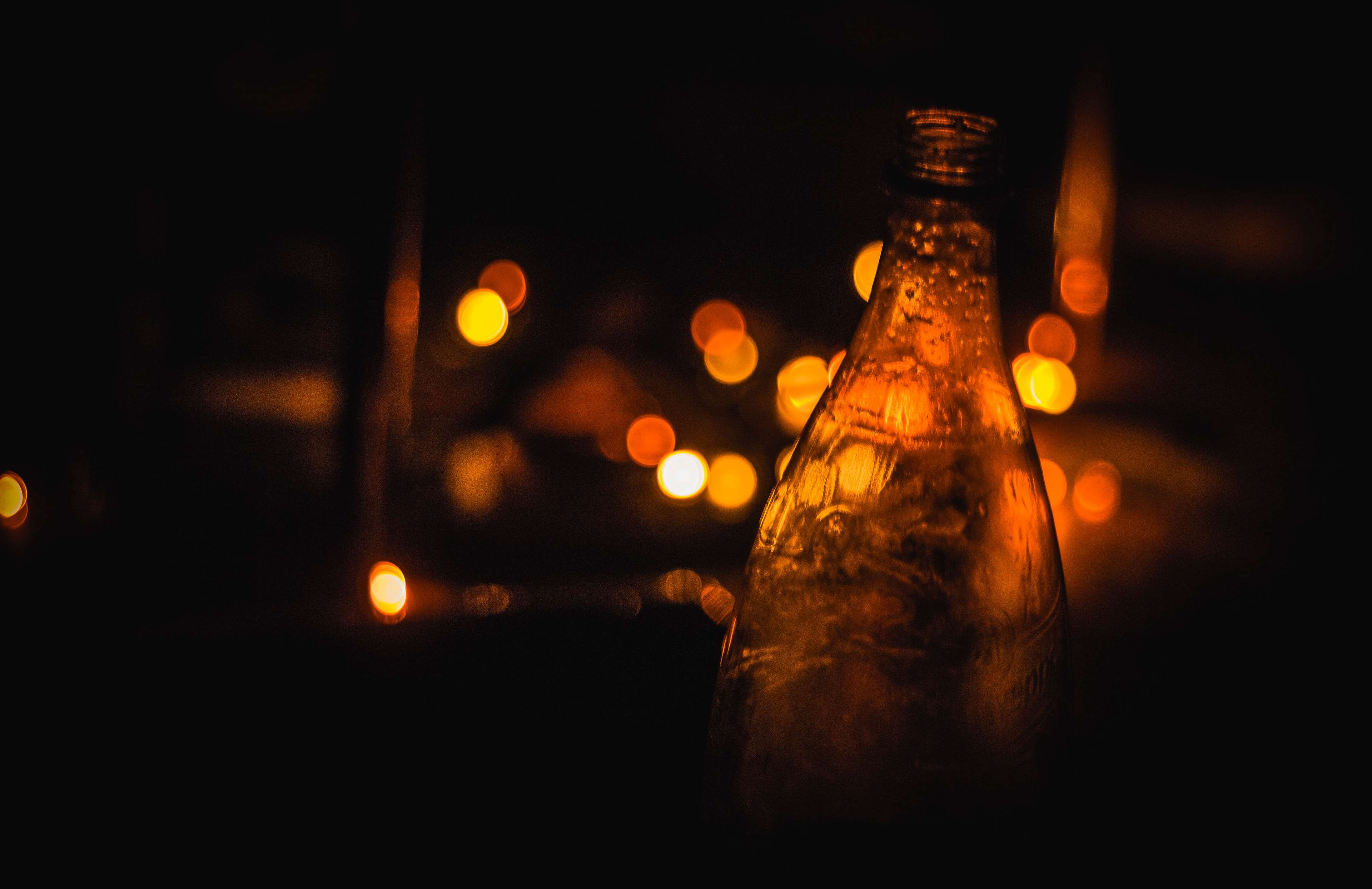 Bottle with bokeh lights HD Wallpaper