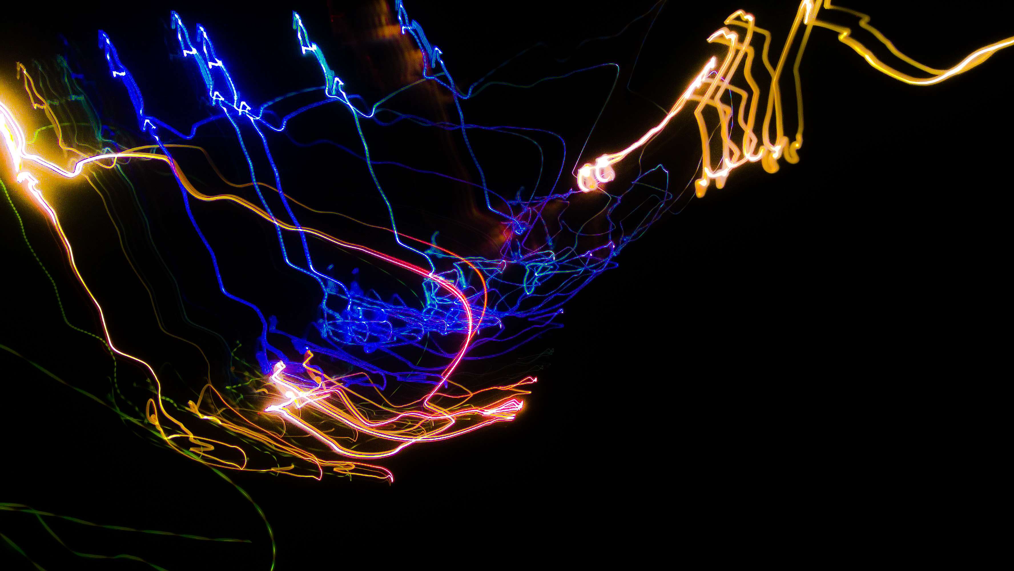 Abstract light painting with blue, yellow, and red streaks HD Wallpaper