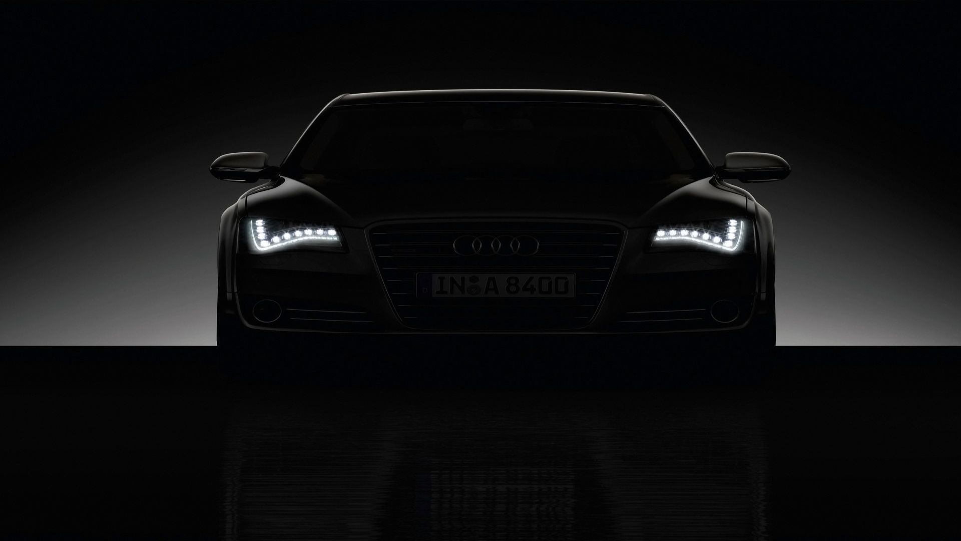 Audi A8 sedan with illuminated headlights HD Wallpaper
