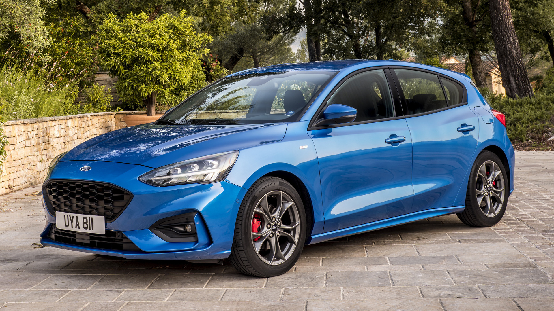 Blue Ford Focus ST-Line parked on a paved surface HD Wallpaper