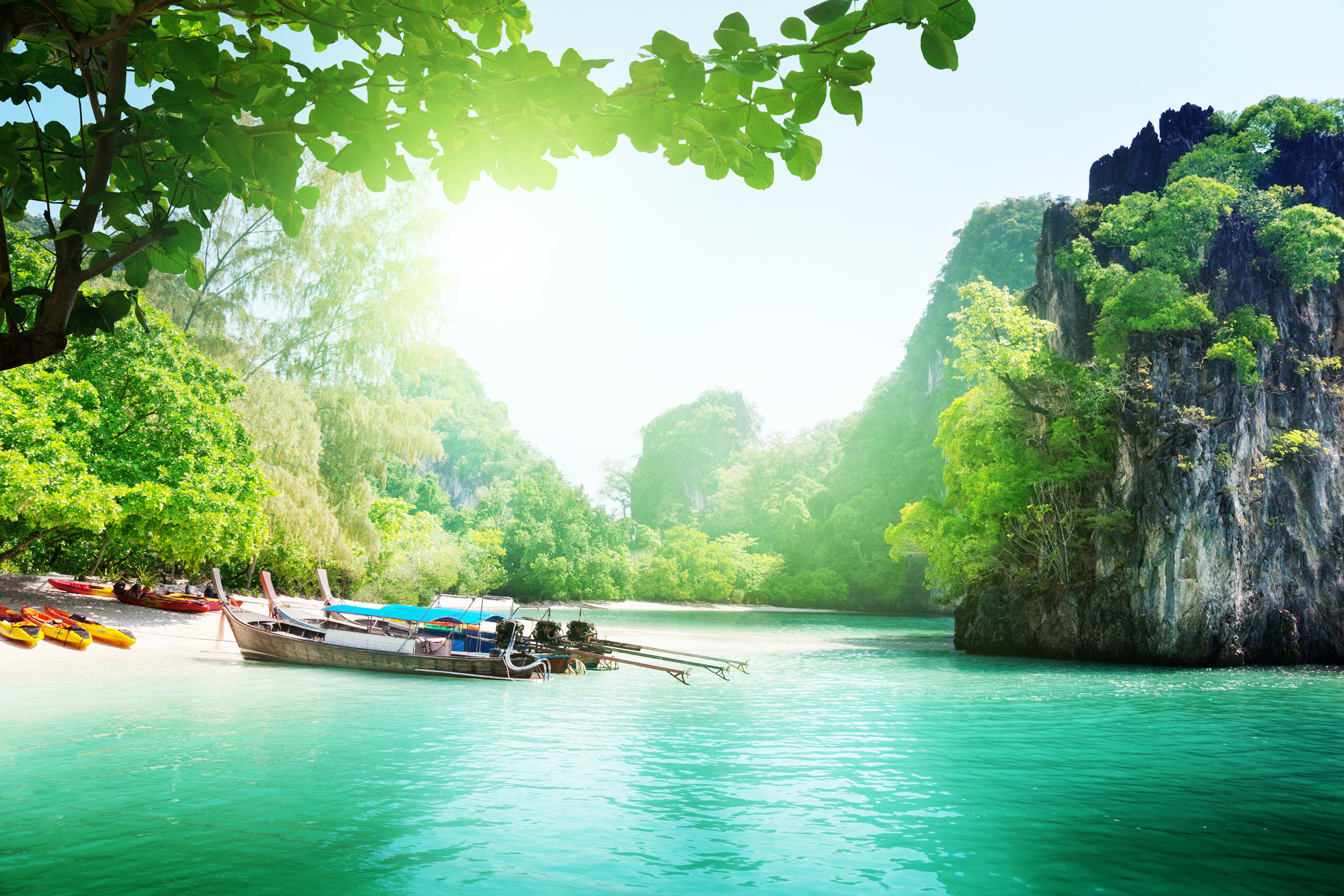 Tropical island with boats and kayaks HD Wallpaper
