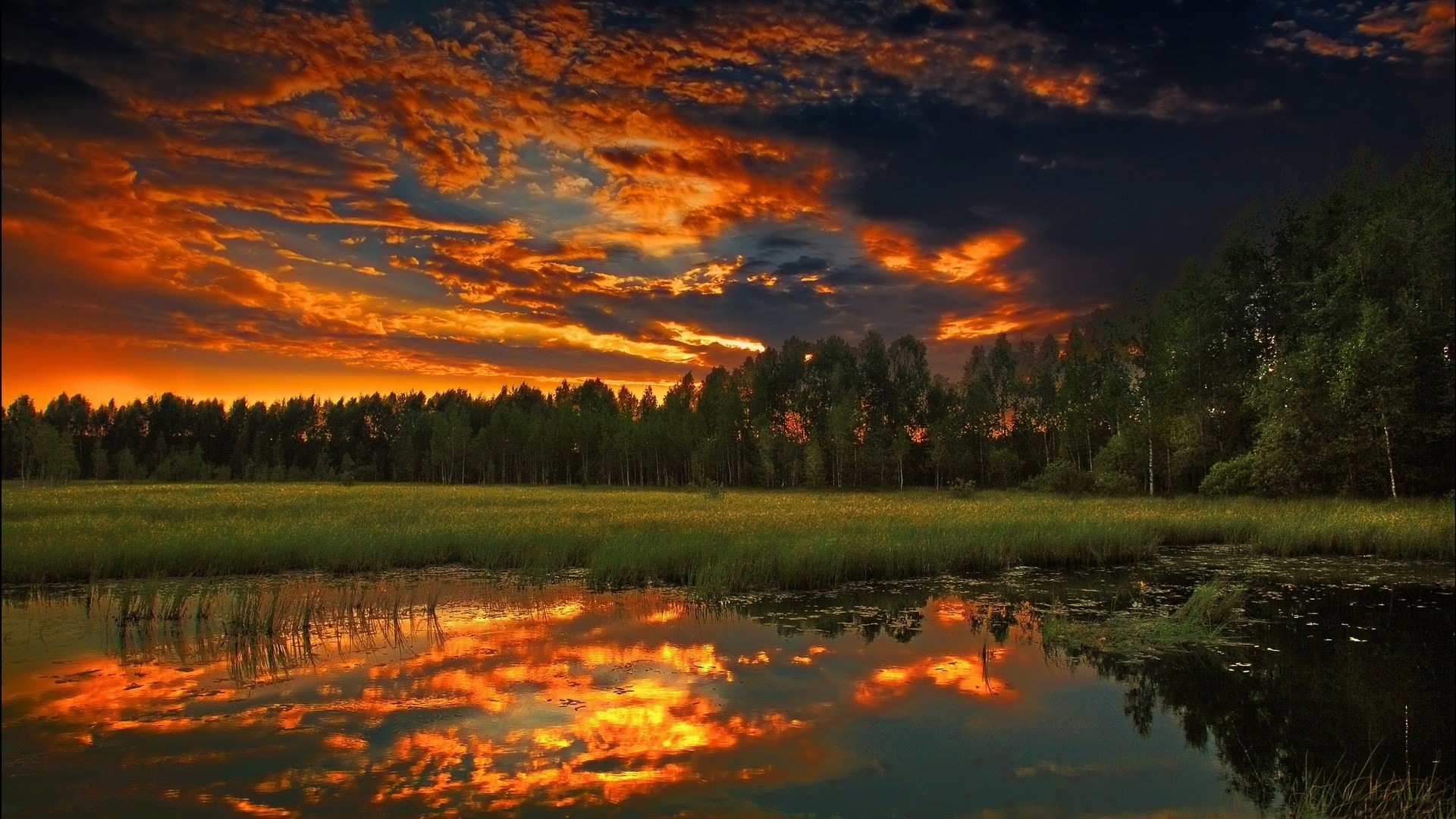 Sunset over a lake with reflections HD Wallpaper