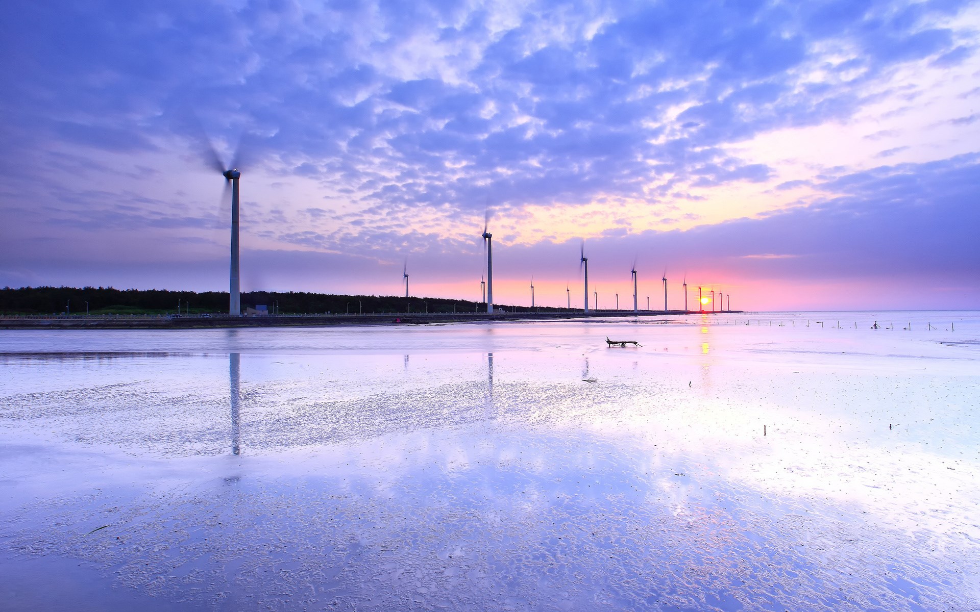 Wind turbines at sunset reflected in water HD Wallpaper