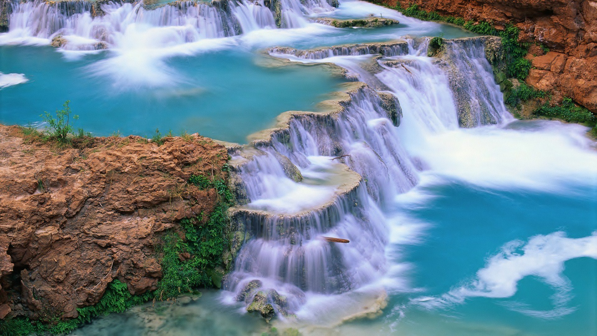 Terraced waterfalls with turquoise pools and red rocks HD Wallpaper