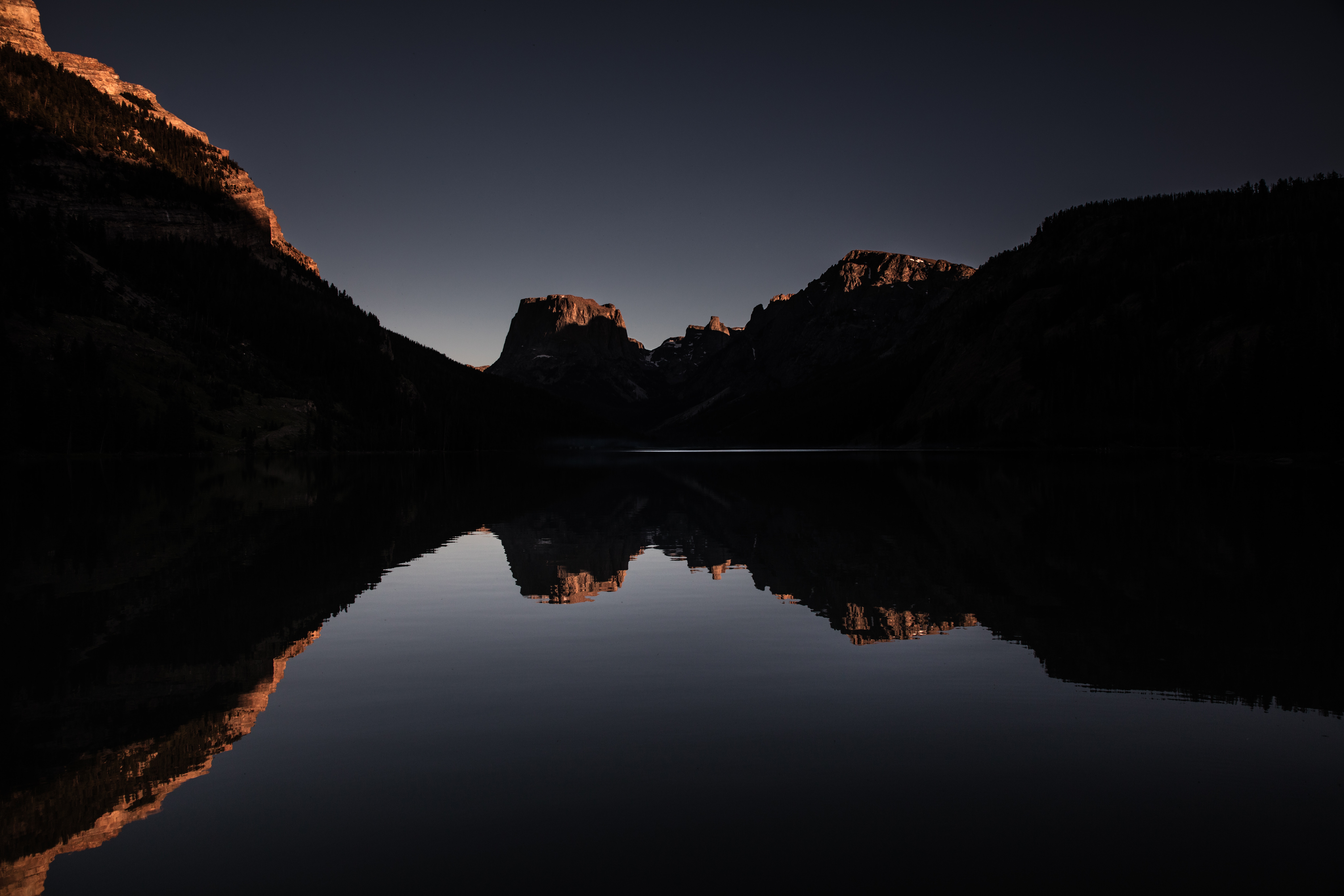Mountain reflection on lake at sunset HD Wallpaper