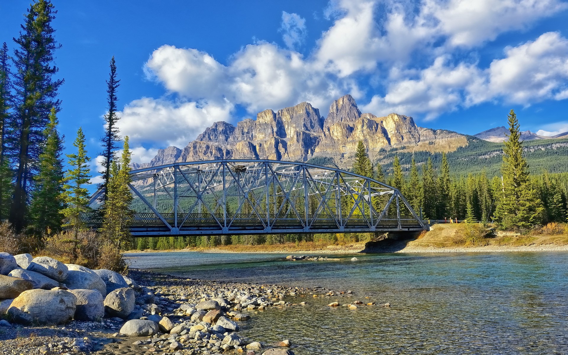 Bridge over a river with mountains and trees HD Wallpaper