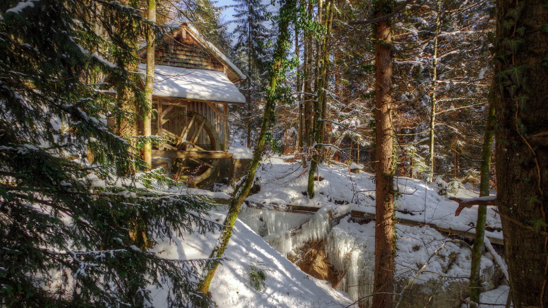 Snowy forest with a wooden mill and water wheel HD Wallpaper
