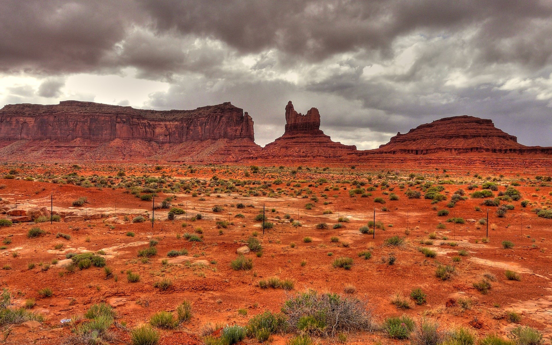 Monument Valley under a cloudy sky HD Wallpaper