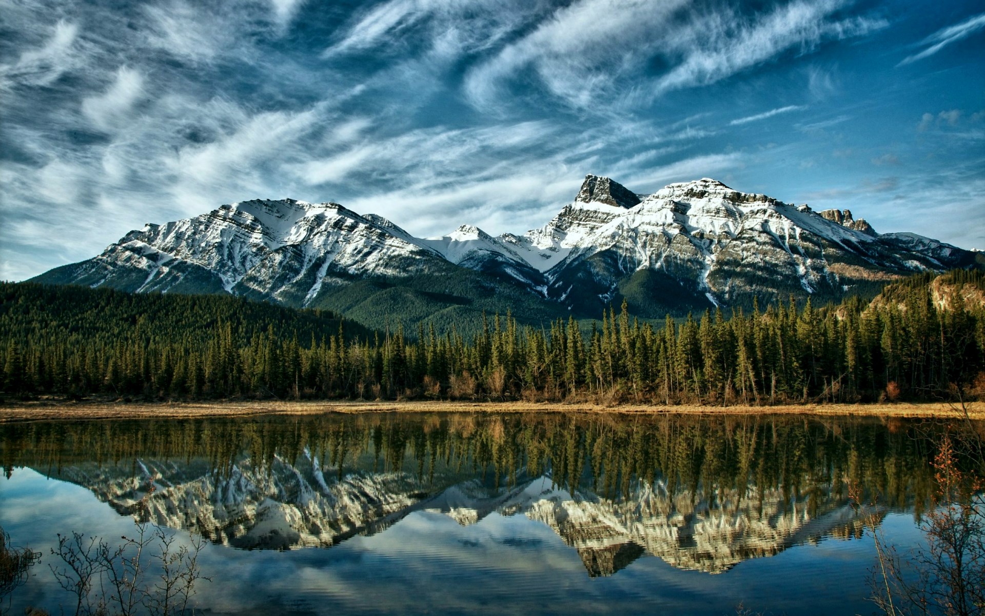 Snow-capped mountains reflected in a lake HD Wallpaper
