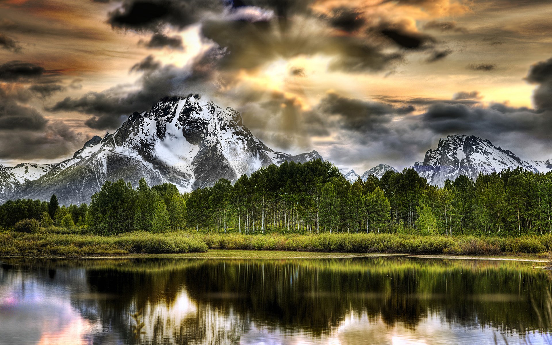 Snow-capped mountains reflected in a lake HD Wallpaper