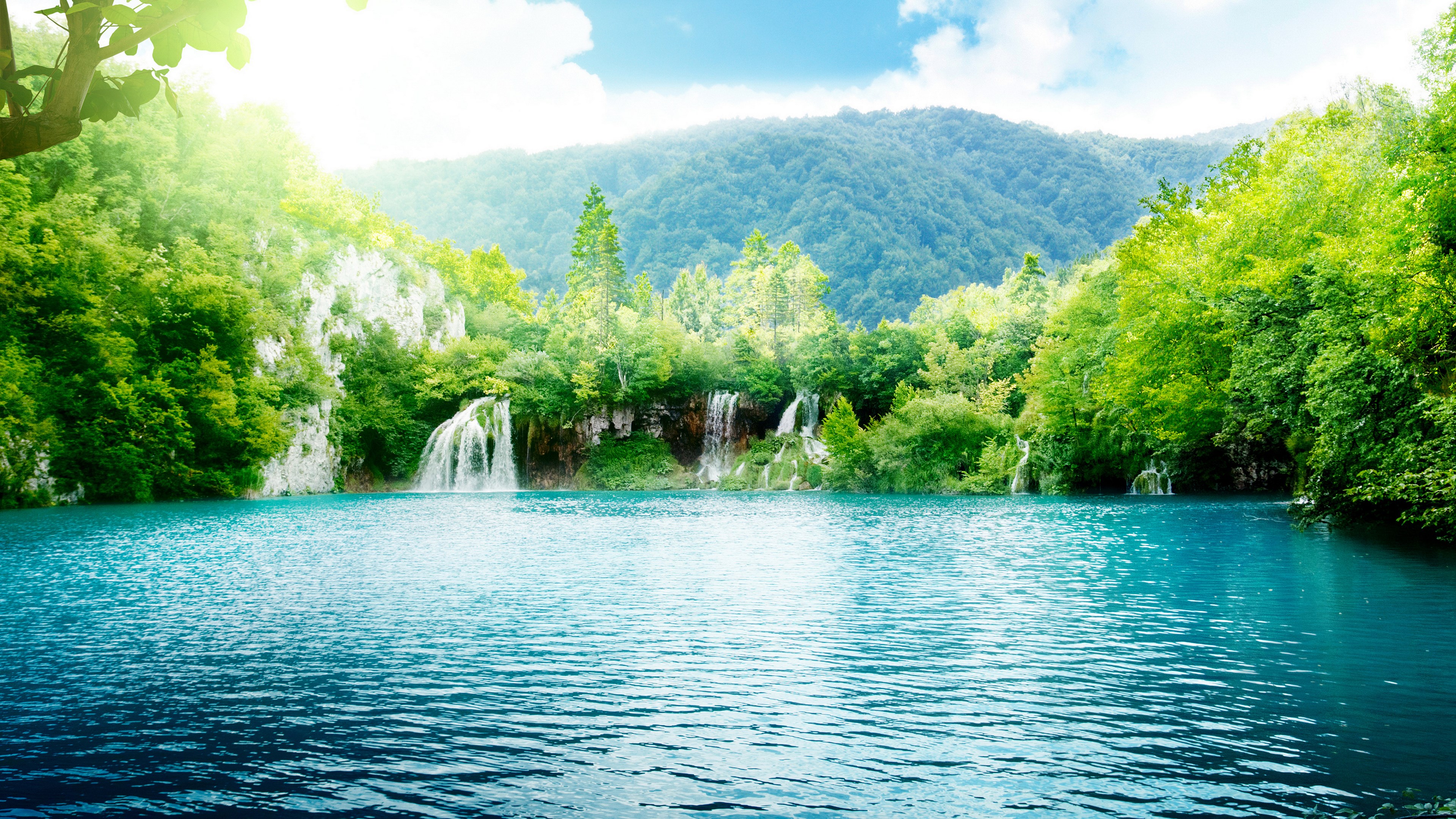 Turquoise lake with waterfalls and green mountains HD Wallpaper
