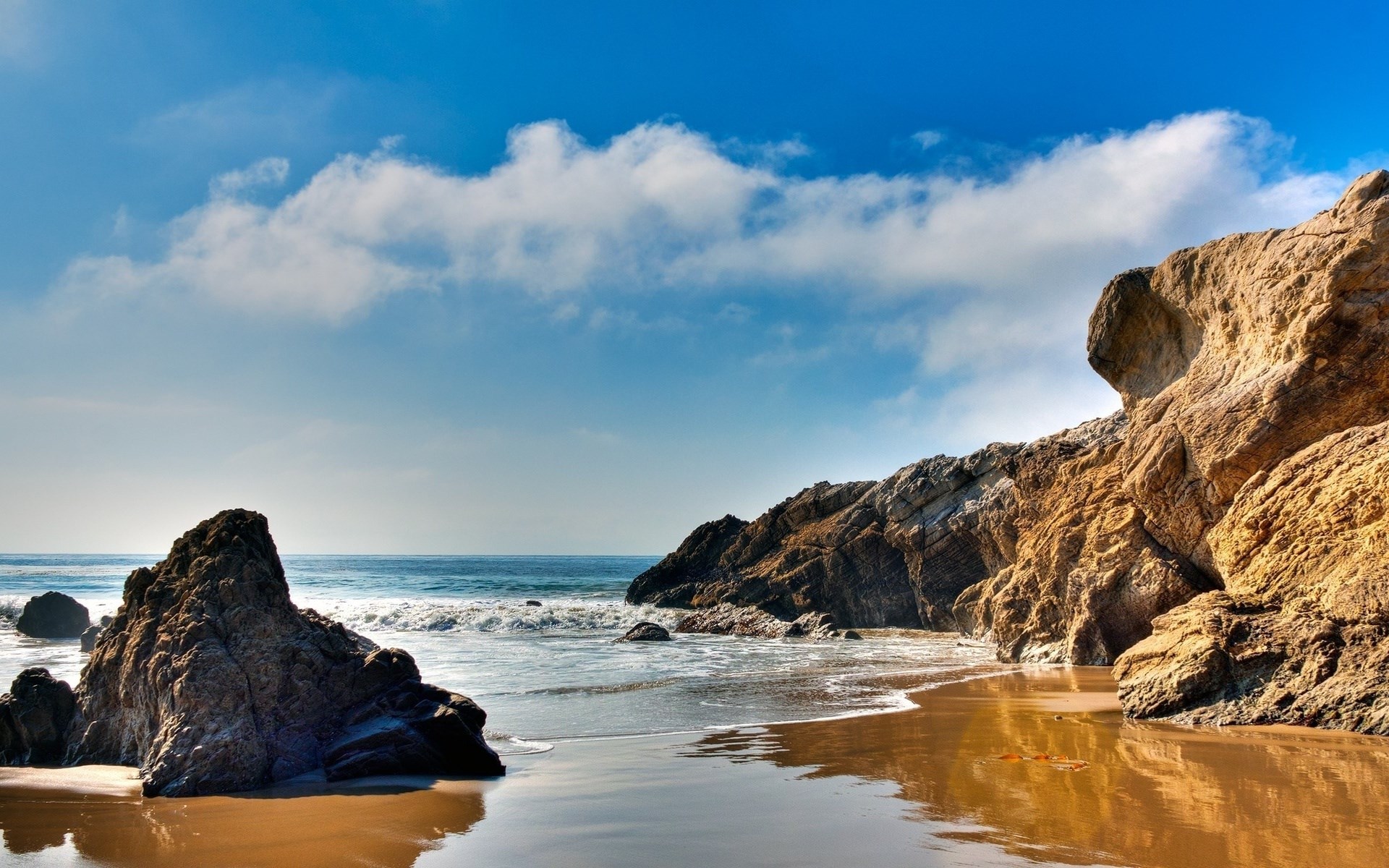 Rocky beach with ocean waves and blue sky HD Wallpaper