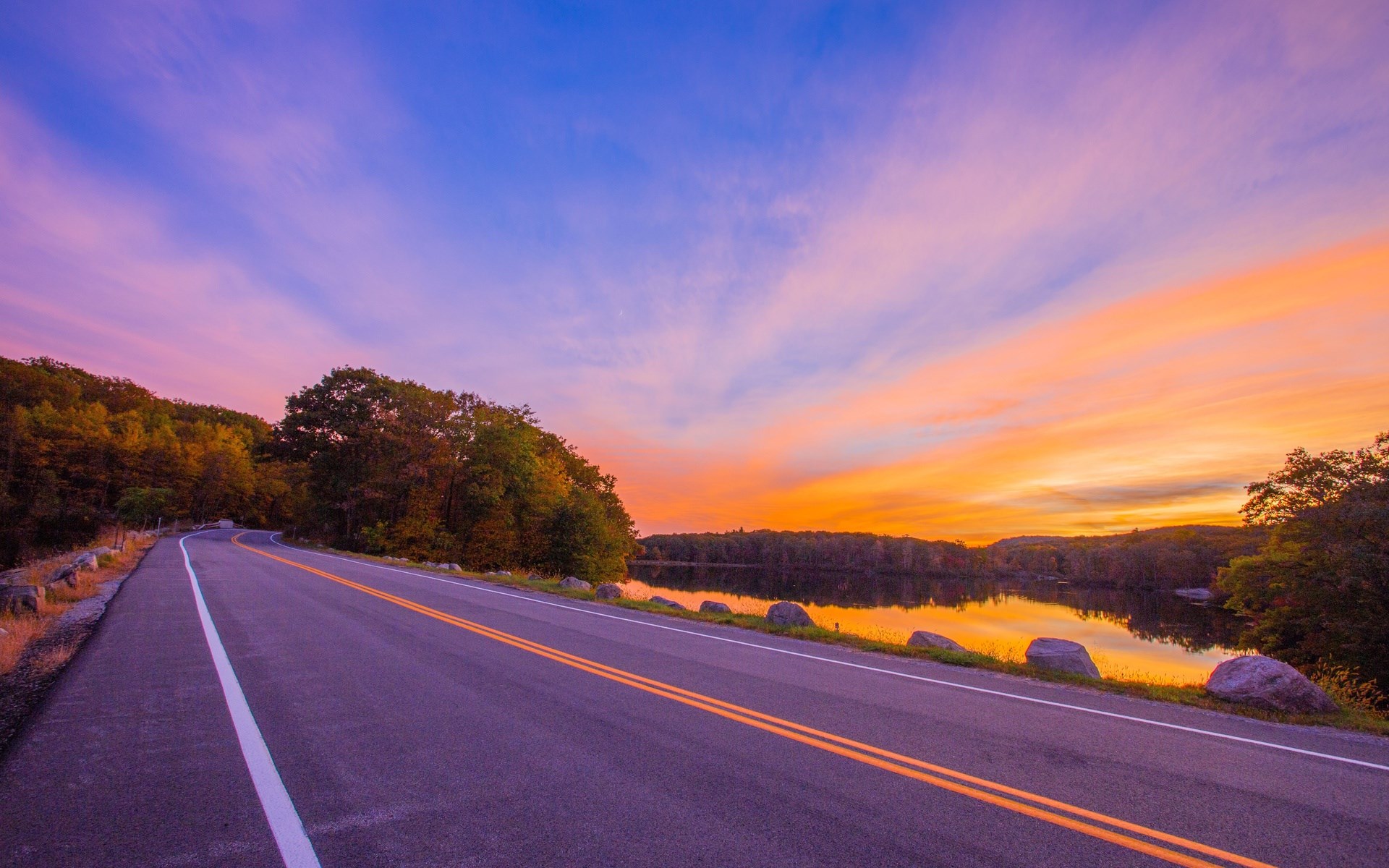 Road by a lake at sunset with colorful sky HD Wallpaper