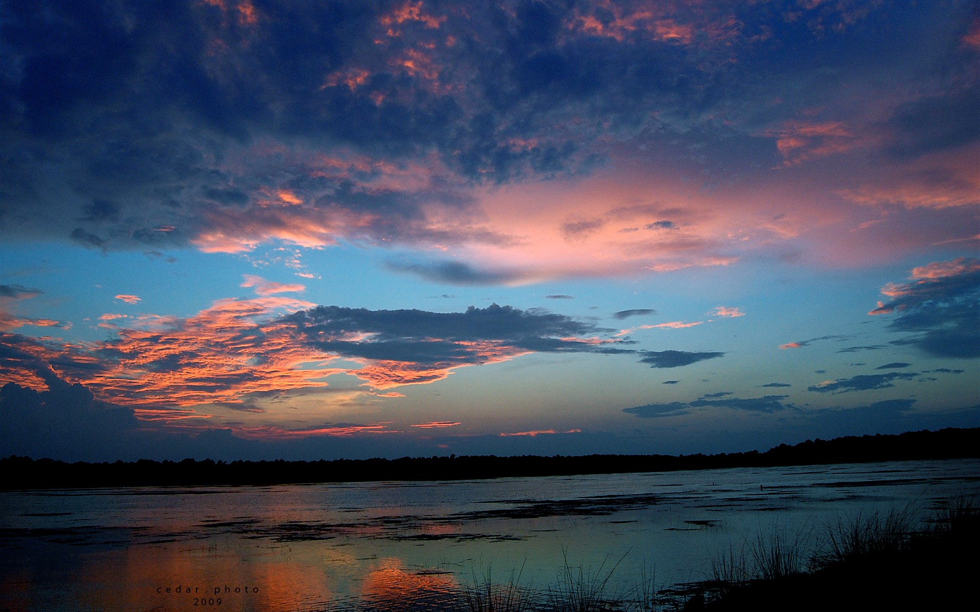 Sunset over a lake with colorful clouds HD Wallpaper