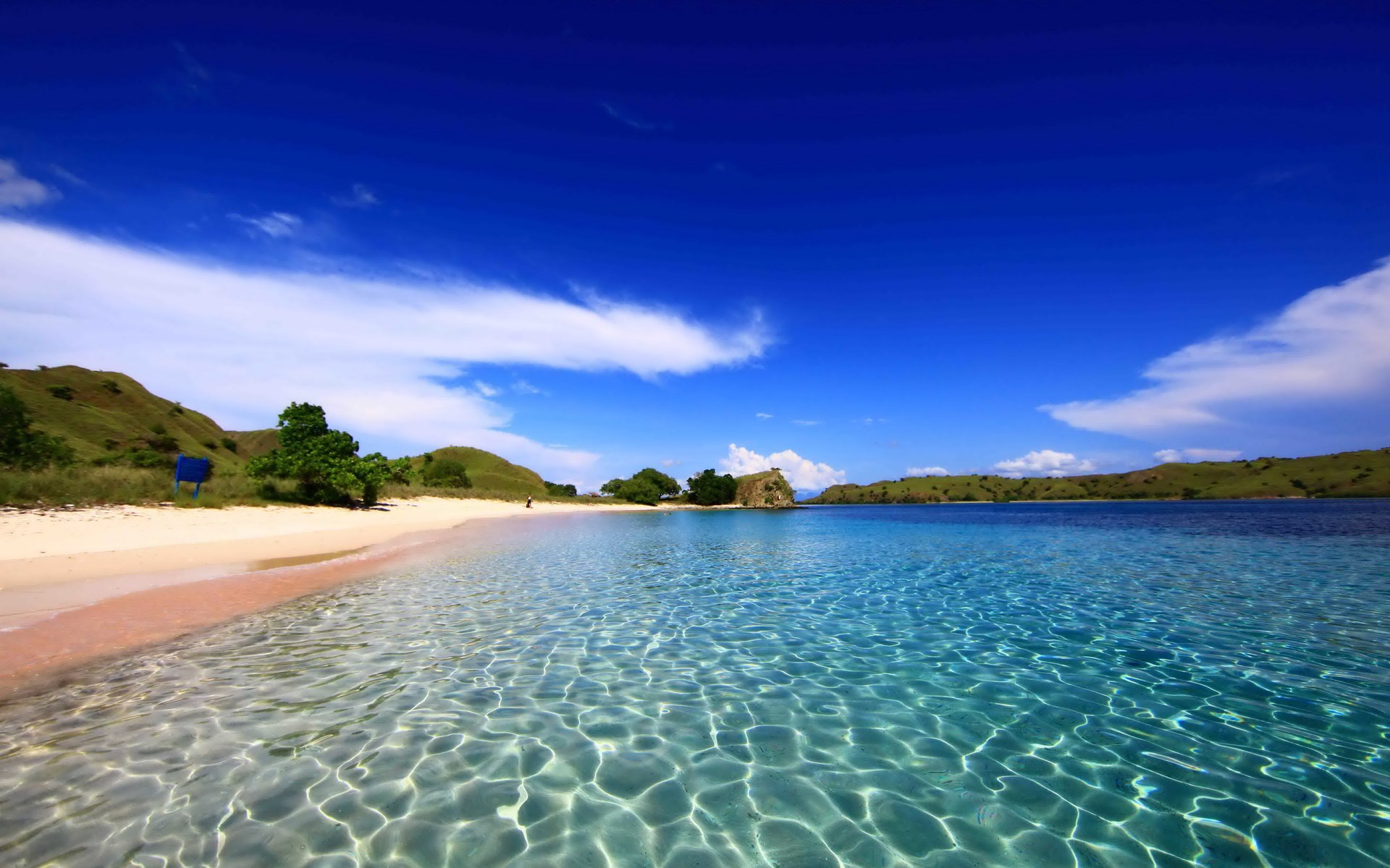 Pink Beach with Turquoise Water and Rolling Hills HD Wallpaper