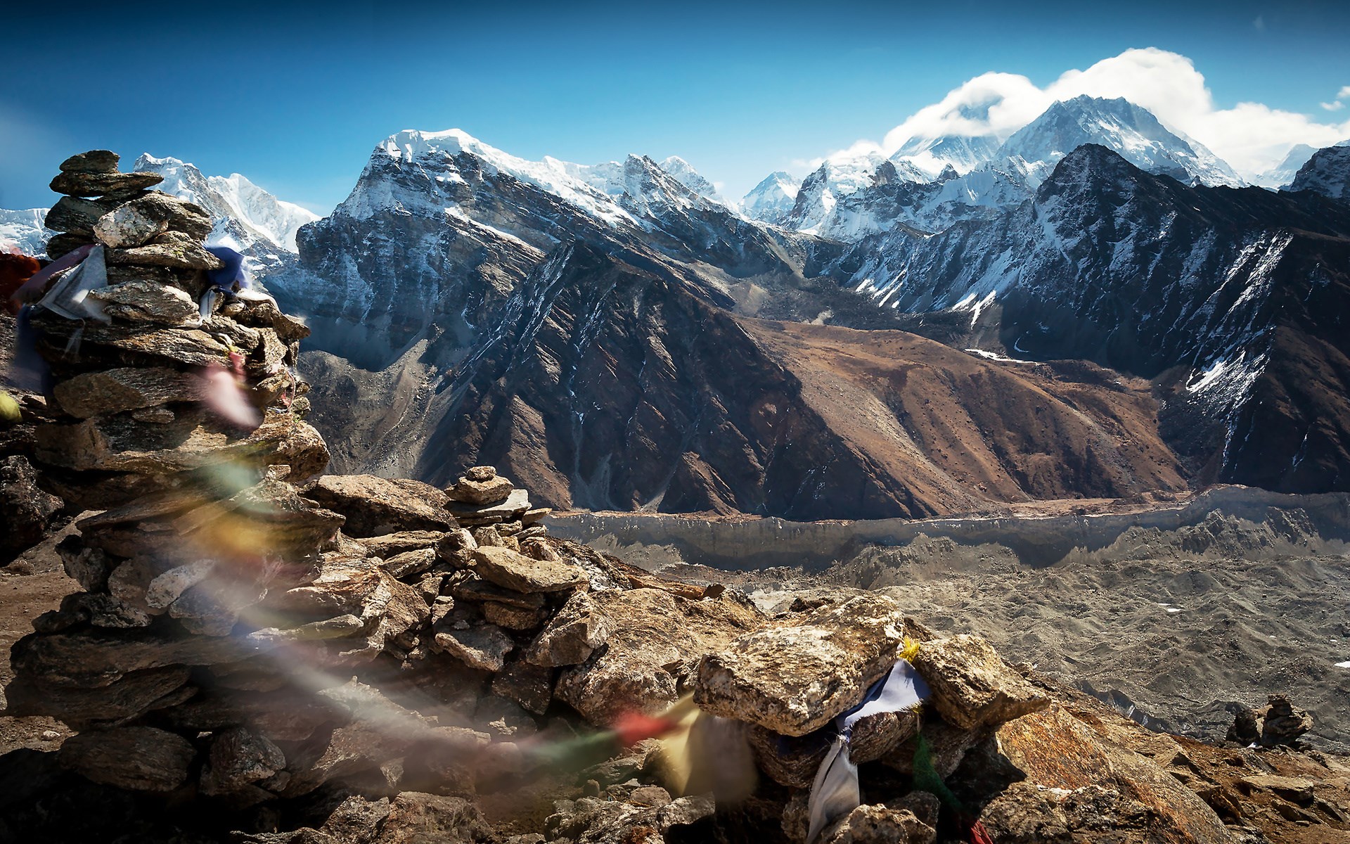Prayer flags on cairns with Himalayan mountains HD Wallpaper