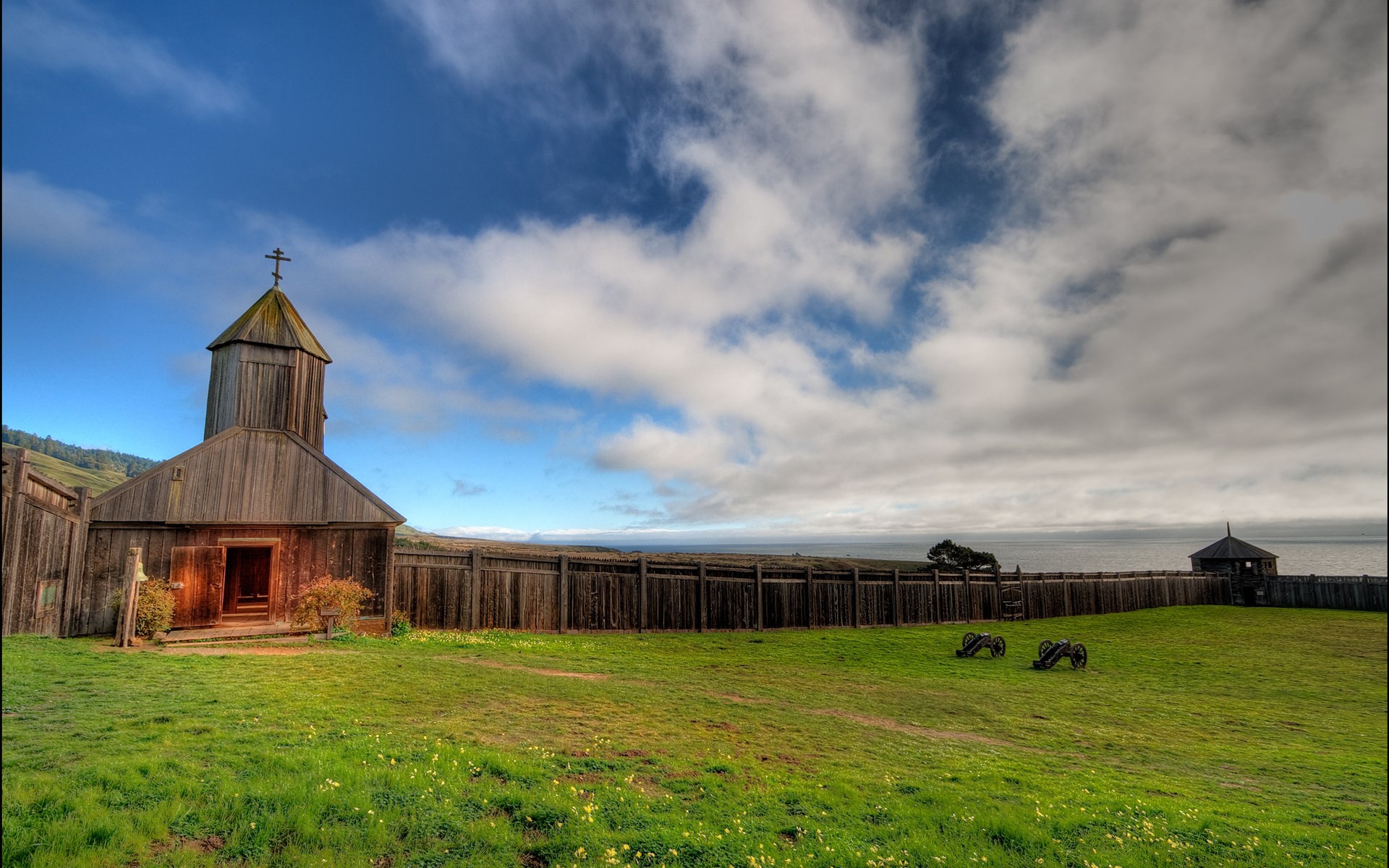 Fort Ross State Historic Park with wooden church and cannons HD Wallpaper