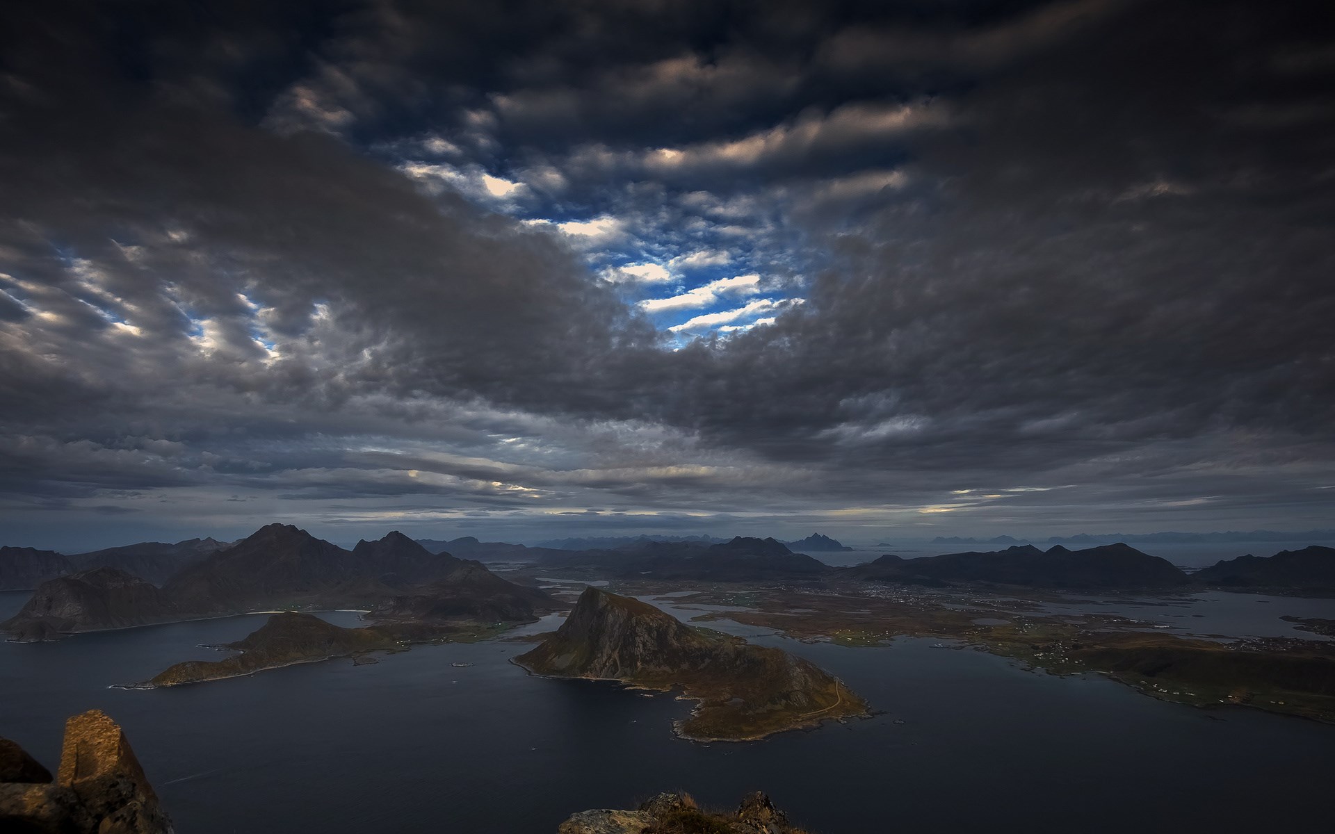 Dramatic clouds over islands and mountains HD Wallpaper
