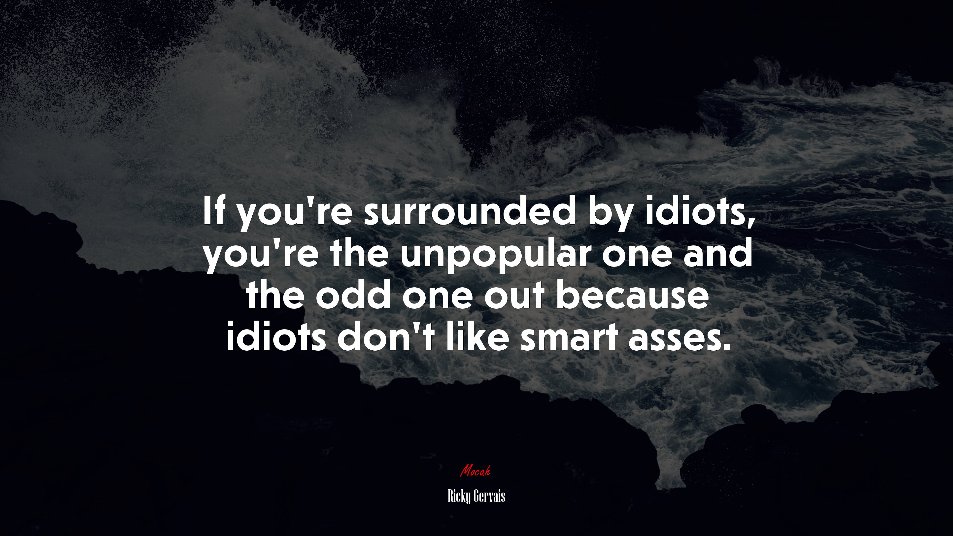 If you’re surrounded by idiots, you’re the unpopular one and the odd one out because idiots don’t like smart asses. | Ricky Gervais quote HD Wallpaper