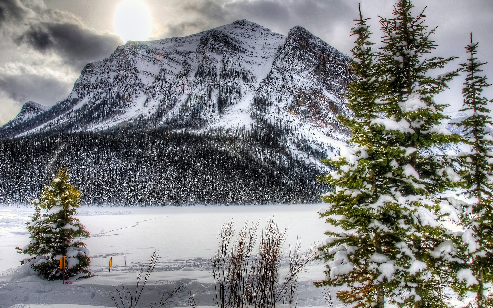 Snowy Mountain Landscape with Pine Trees and Frozen Lake HD Wallpaper