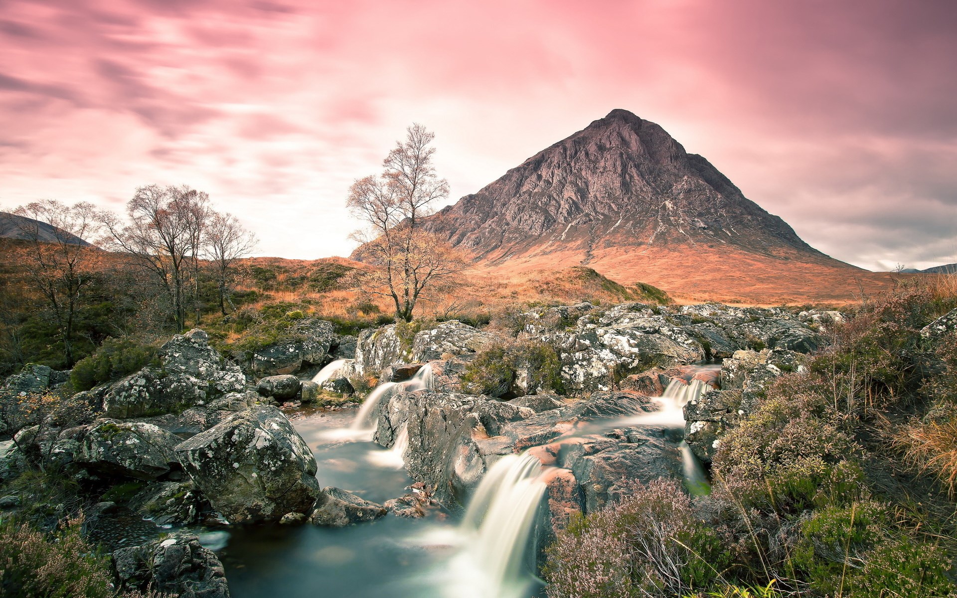Mountain landscape with a waterfall and pink sky HD Wallpaper