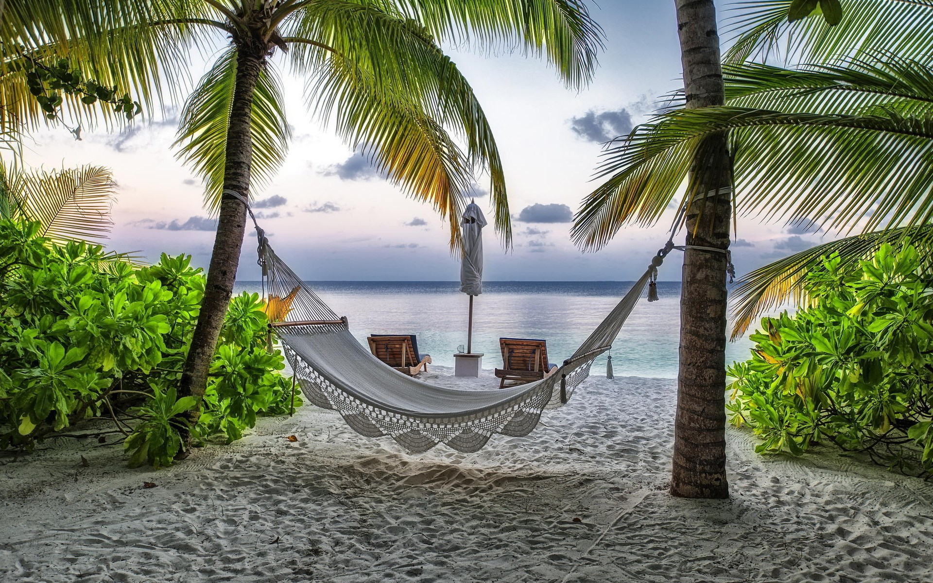 Hammock on a tropical beach at sunset HD Wallpaper